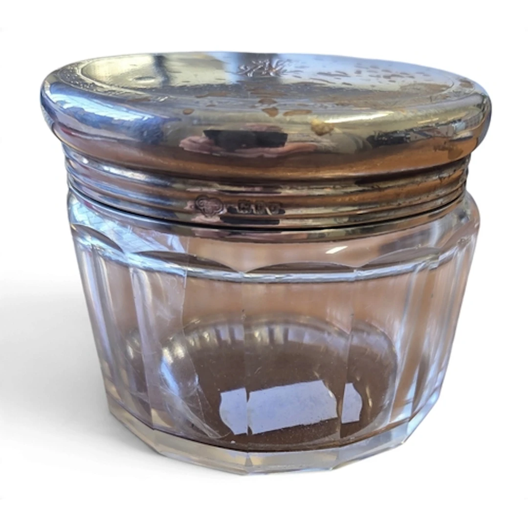 A Silver topped cut Glass vanity Jar, Goldsmiths & Co London...
