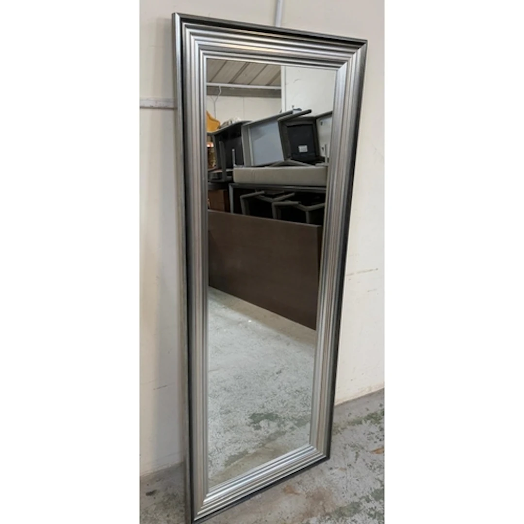 A Rectangular wall mirror with a silver frame