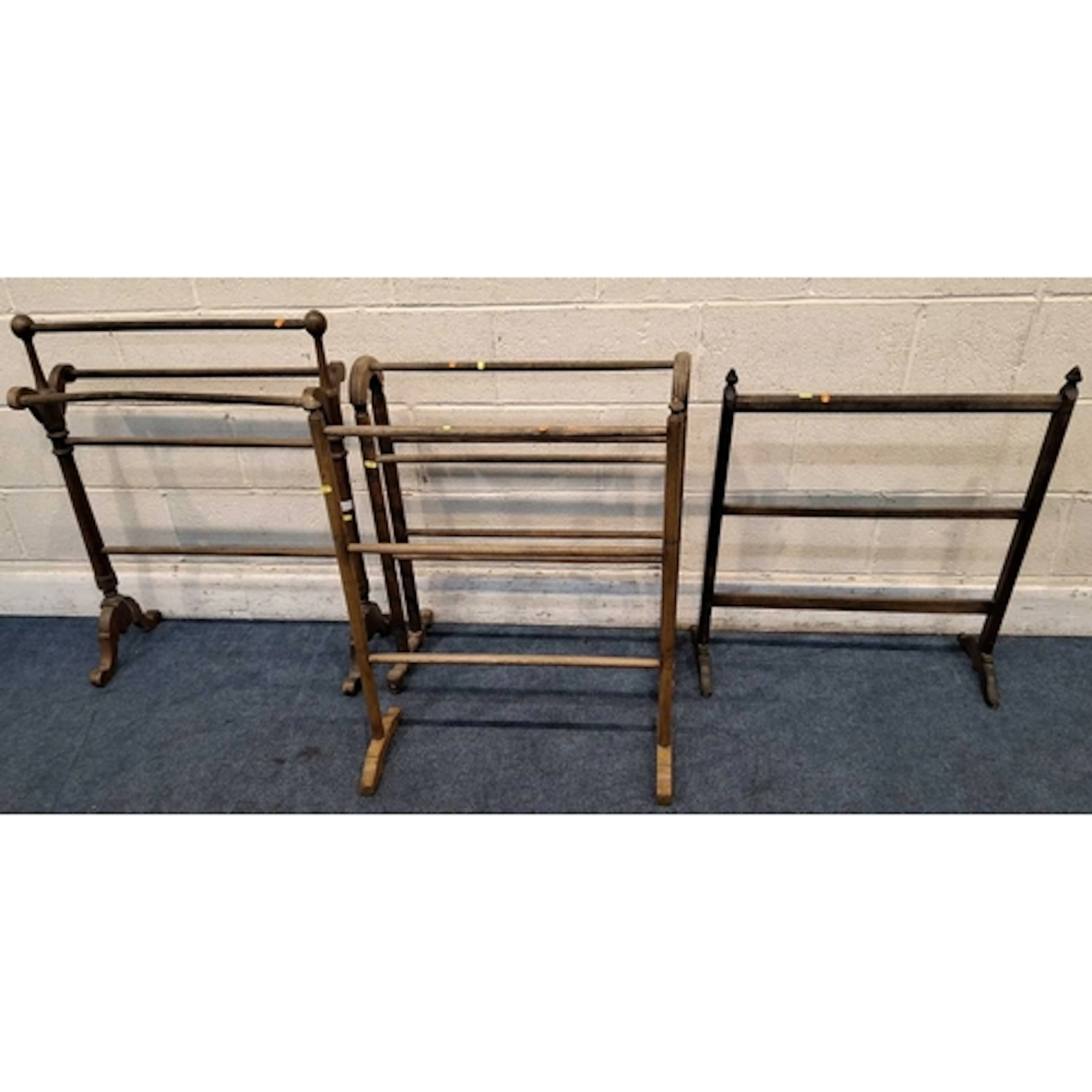 FOUR TOWEL RAILS, all varying in shape size, style, timber, ...