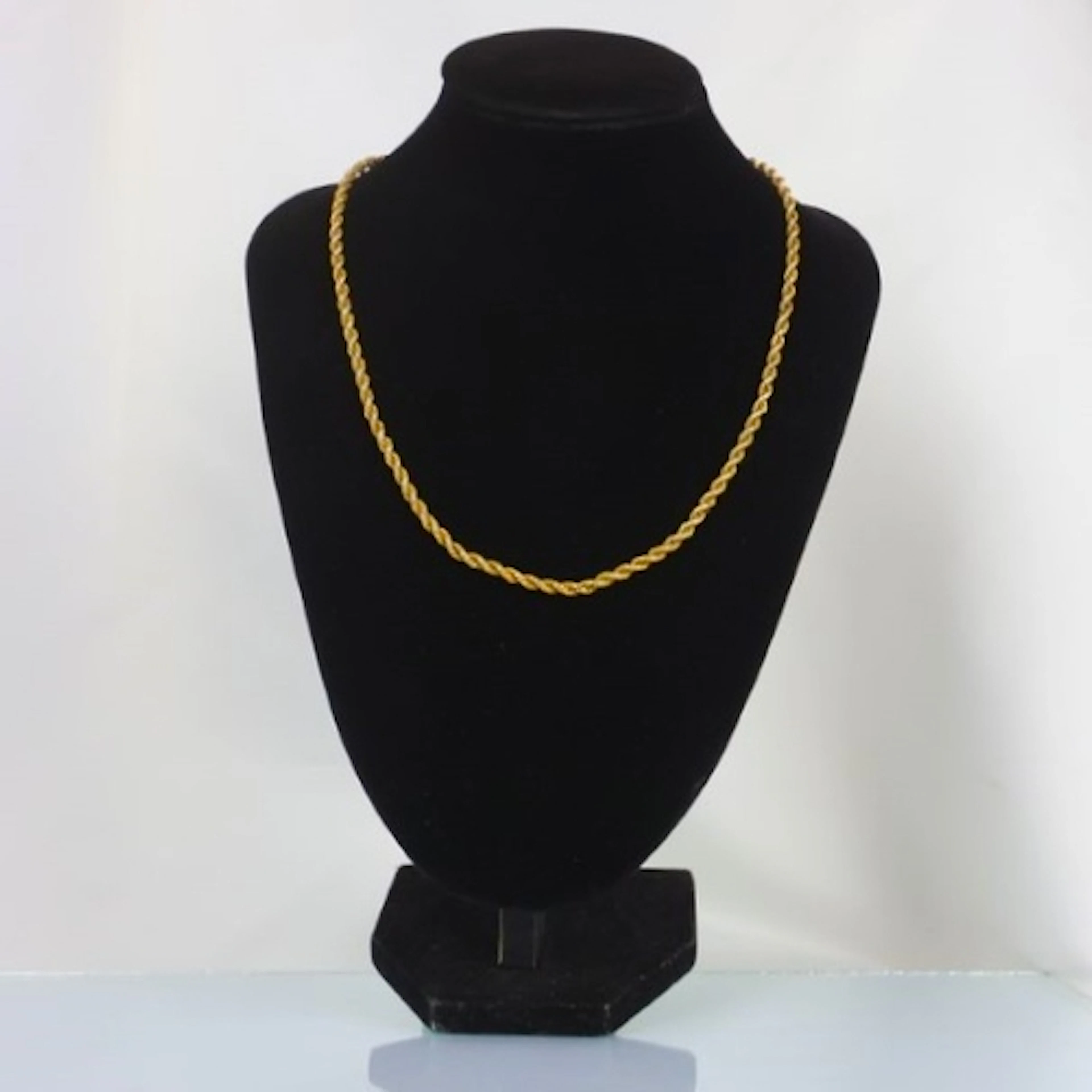 A late 20th century yellow metal chain, the rope twist chain...