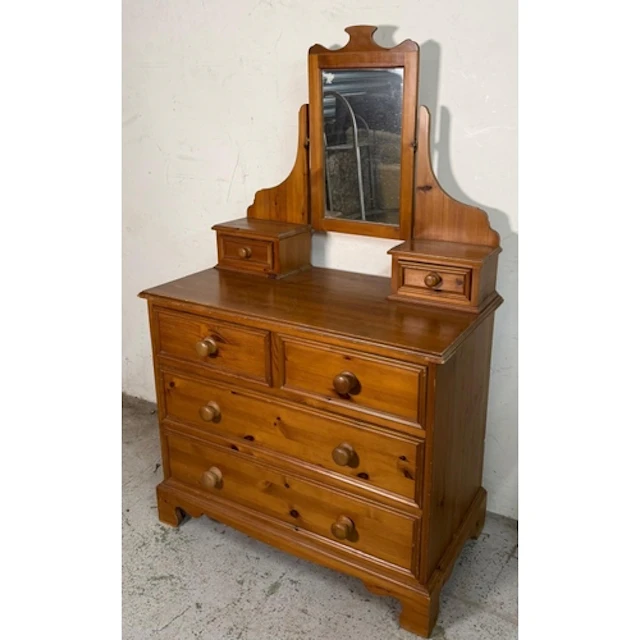 A Pine dressing table with swing mirror flanked by trinket d...