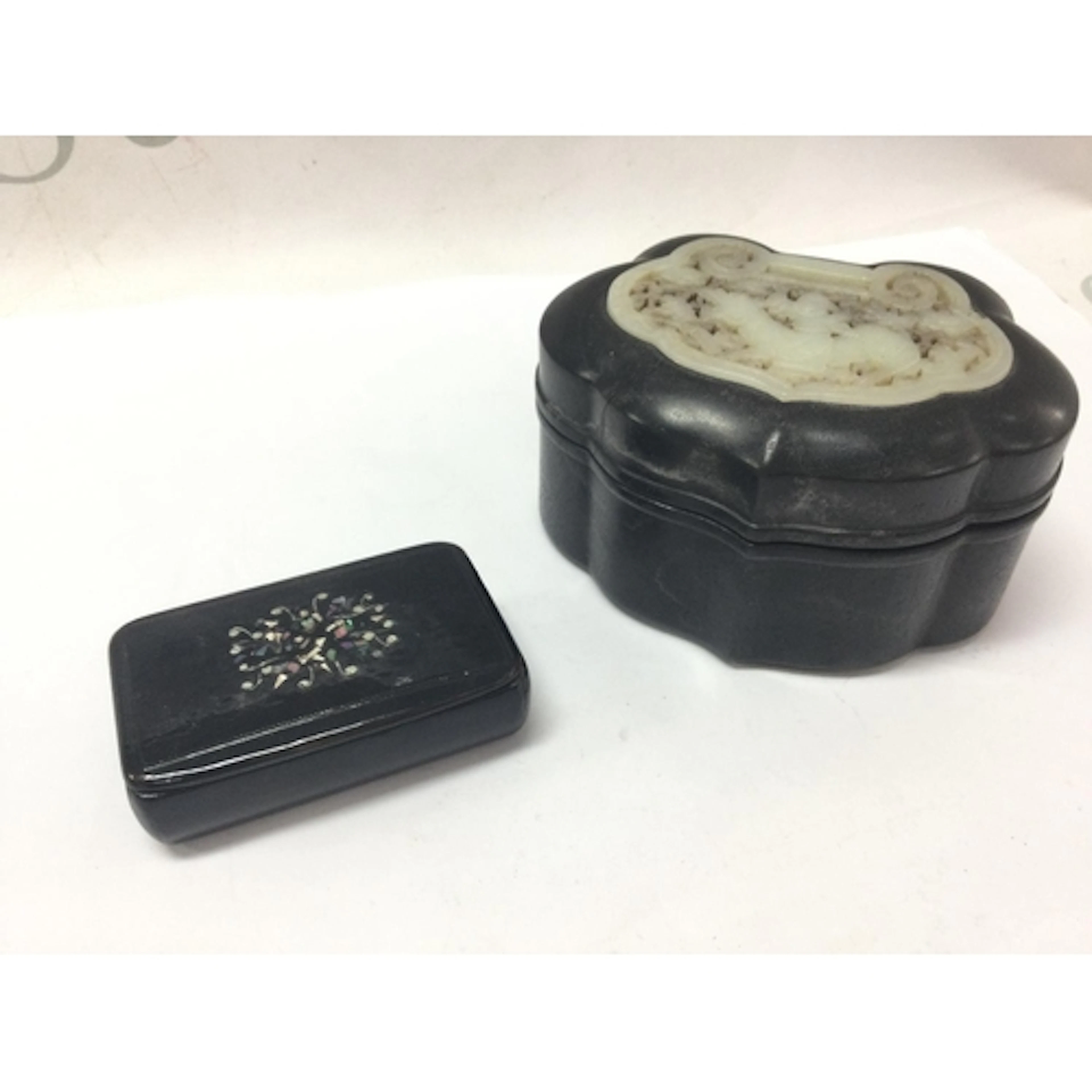A Chinese ebony wood jade inset trinket box and a paper mach...