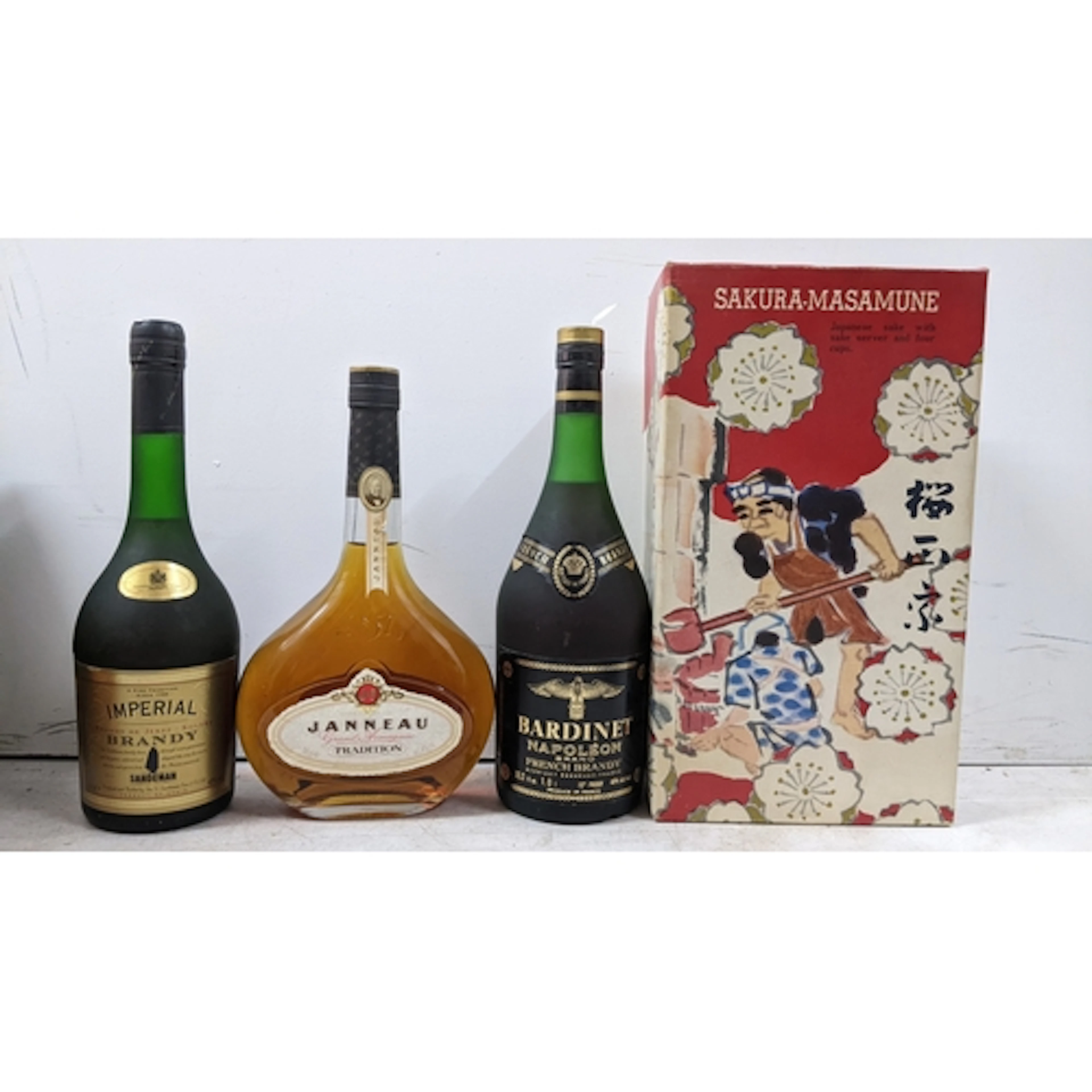 A mixed group of four bottles, comprising: - Janneau Traditi...
