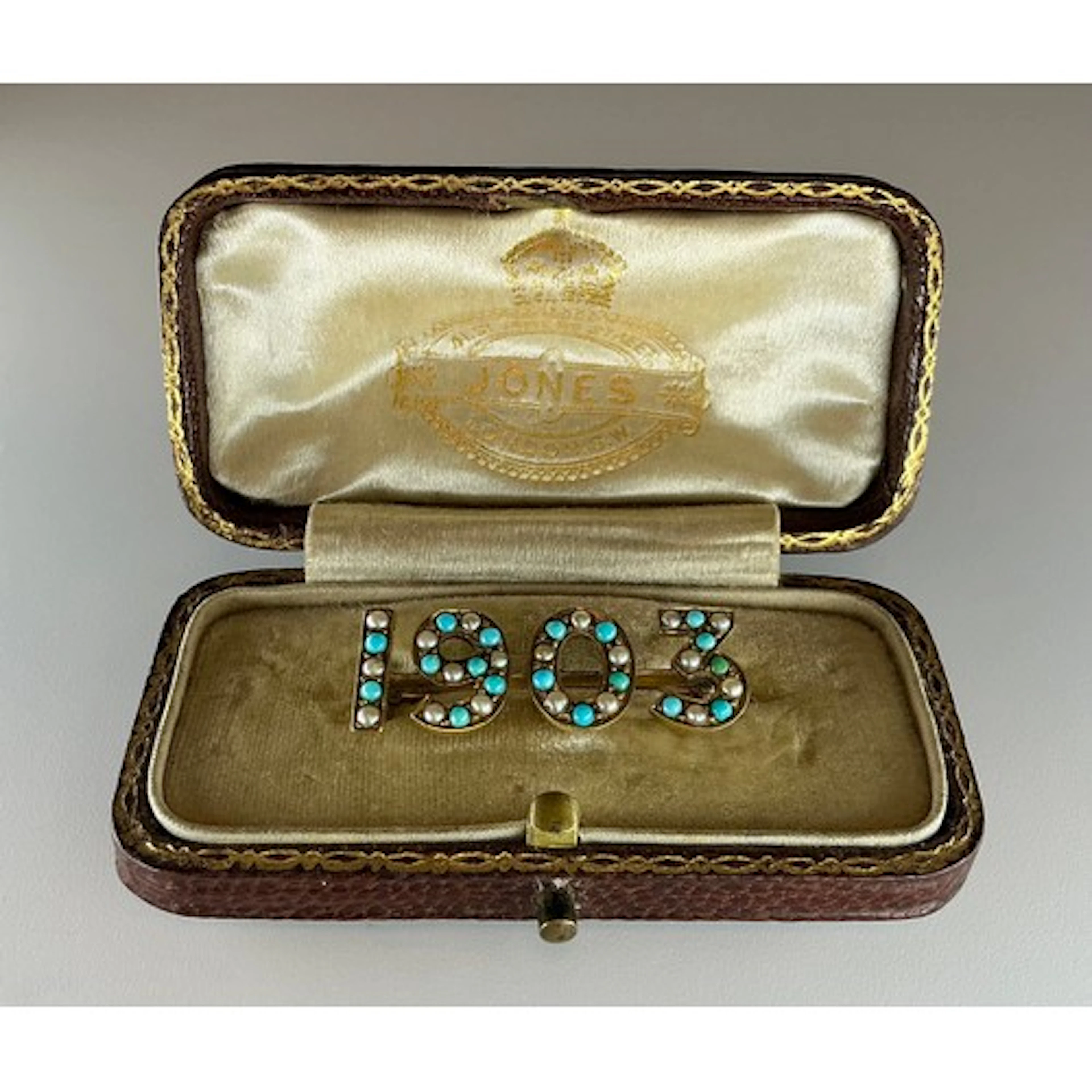 A tested 9ct gold "1903" turquoise and seed pearl brooch, th...