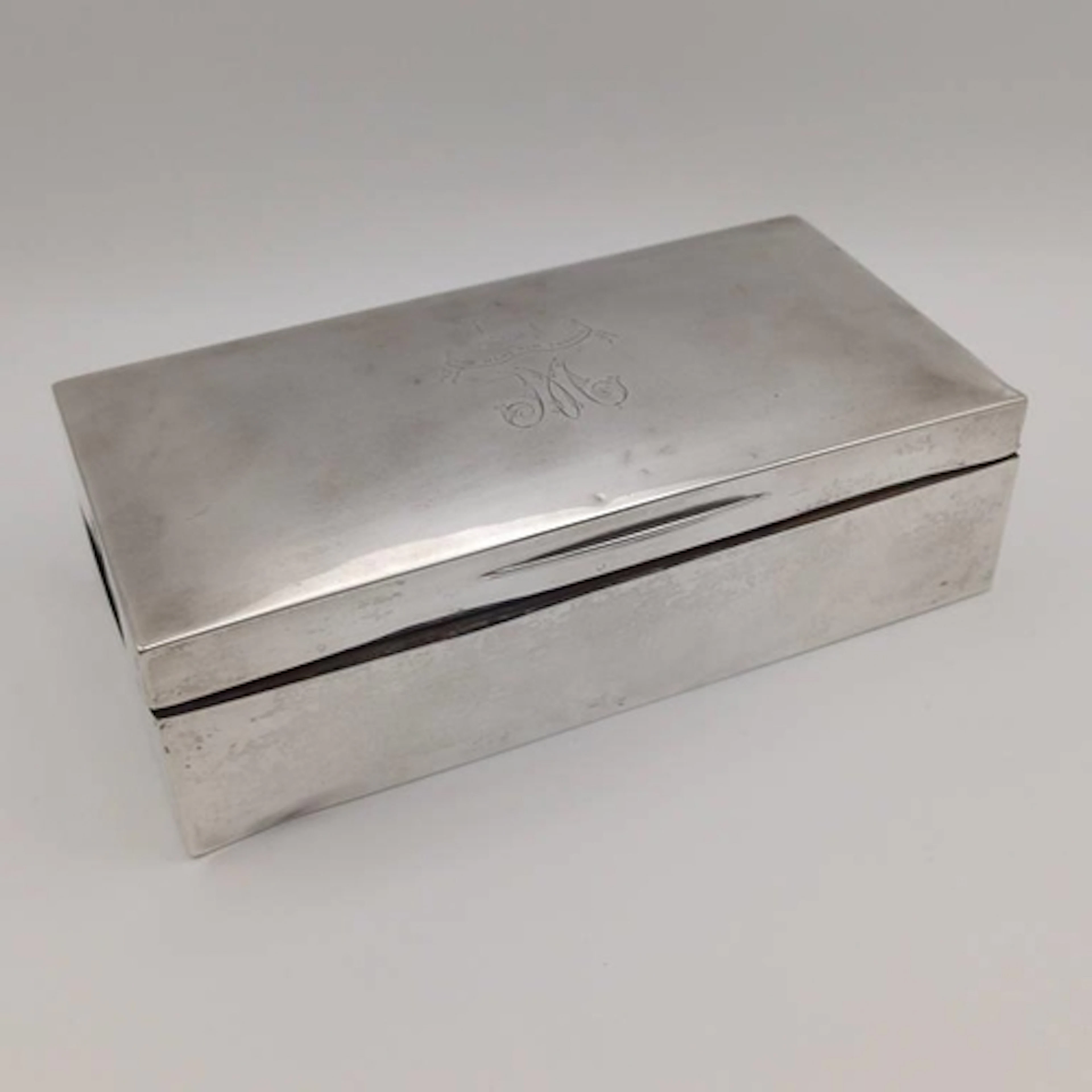 A SILVER RECTANGULAR CIGARETTE BOX BY STUART CLIFFORD & CO, ...