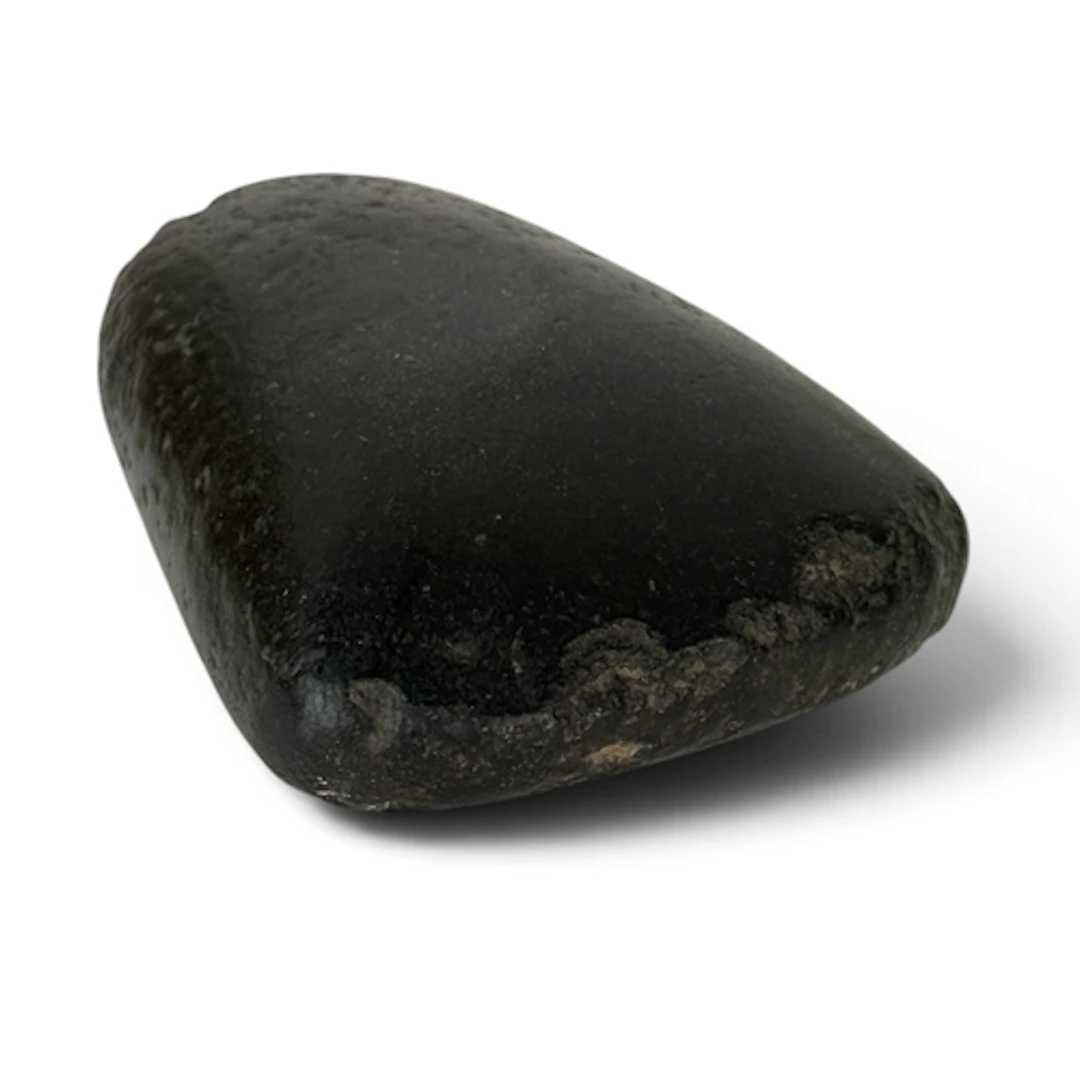 A BLACK STONE AXE HEAD Locality unknown. 6cm L...