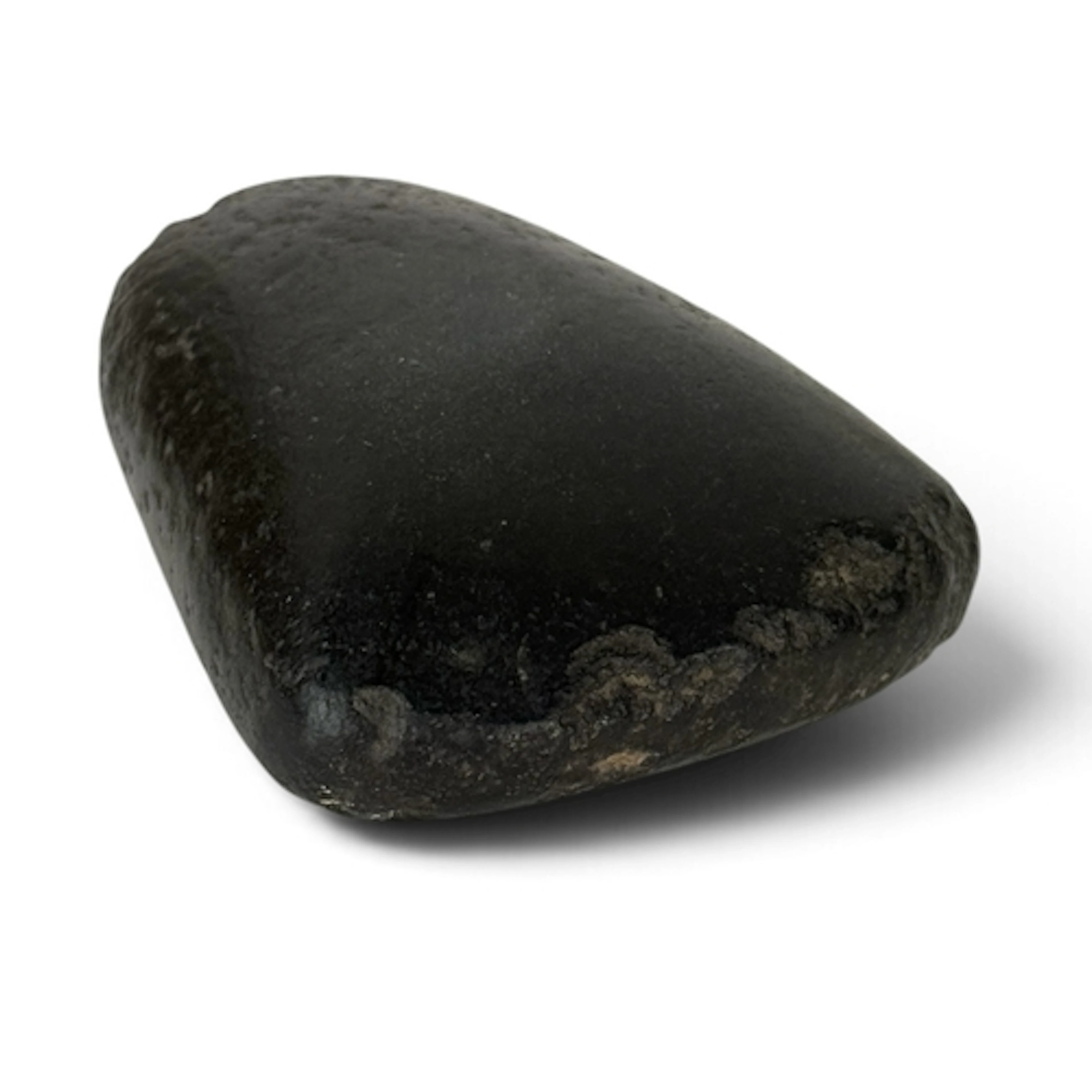 A BLACK STONE AXE HEAD Locality unknown. 6cm L...