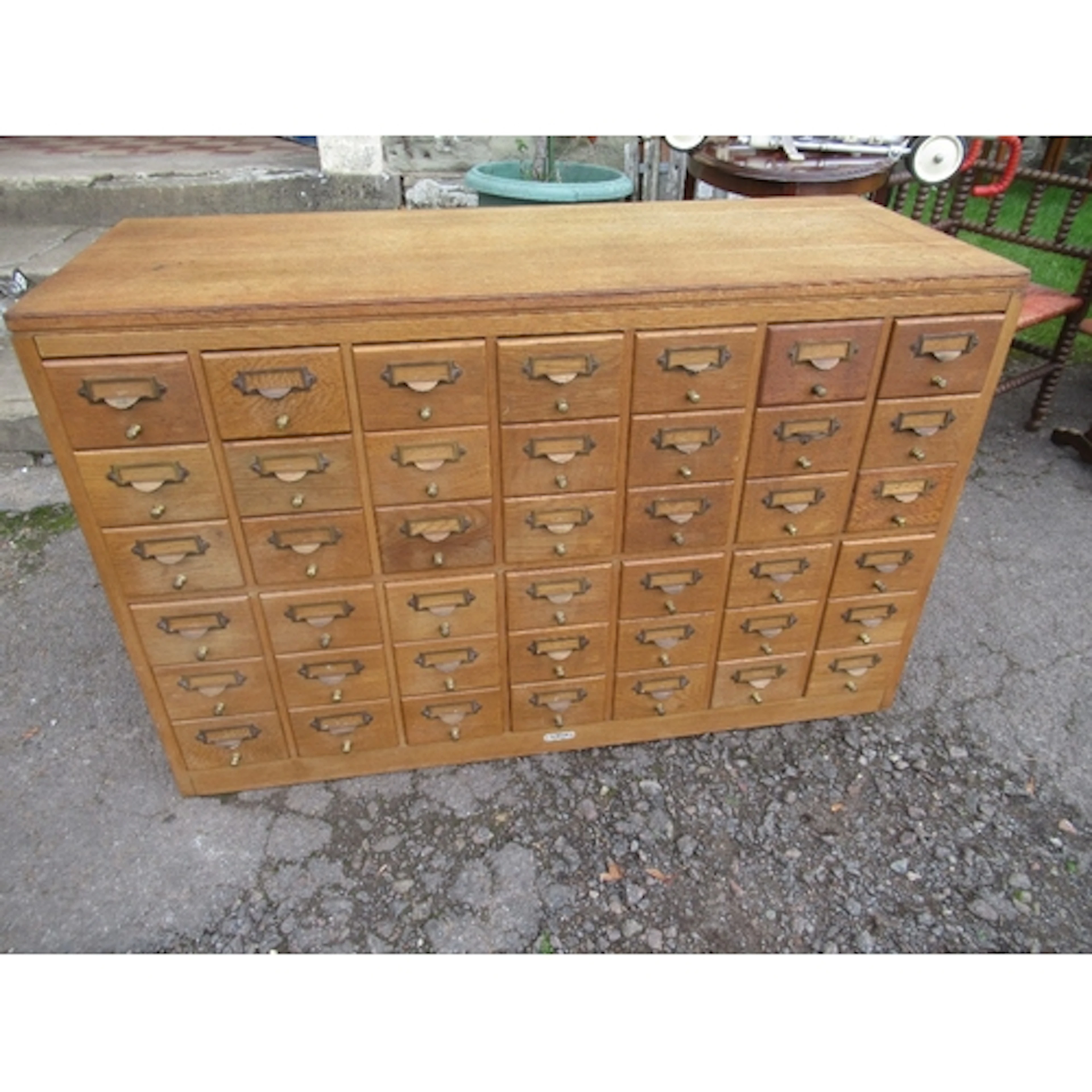 A vintage oak set of filling drawers width 45ins , depth 18i...