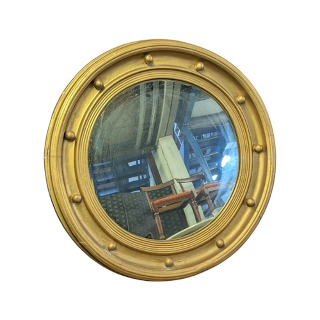 A vintage 20th century Regency Revival convex wall mirror ha...