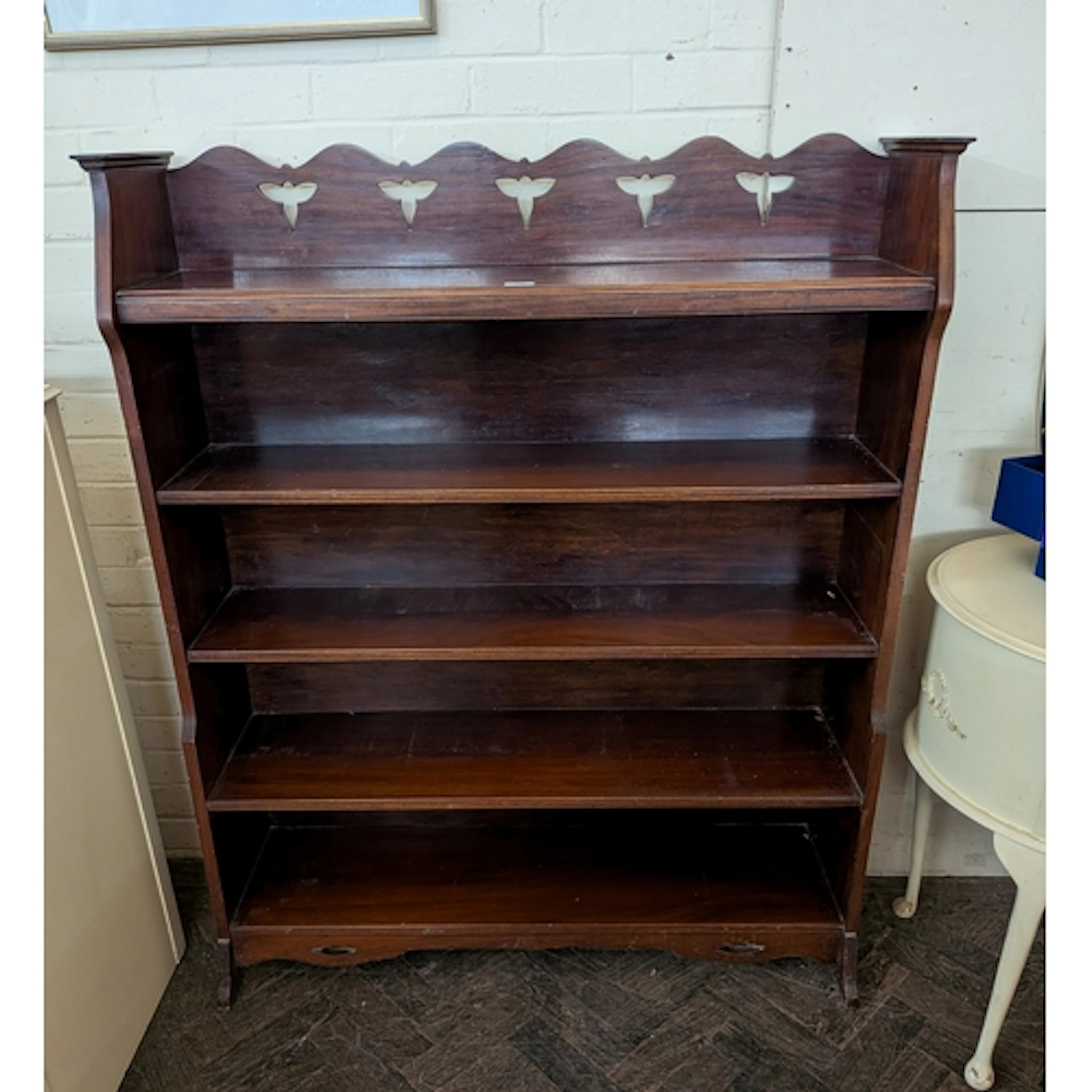 A 1920's /1930's Arts and Crafts style five tier mahogany op...