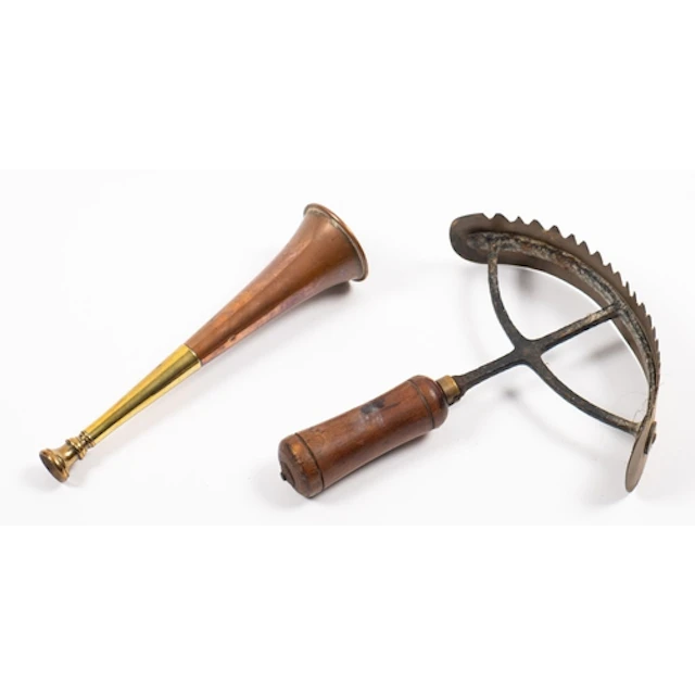 An early 20th Century brass and iron sweat scraper. Having a...