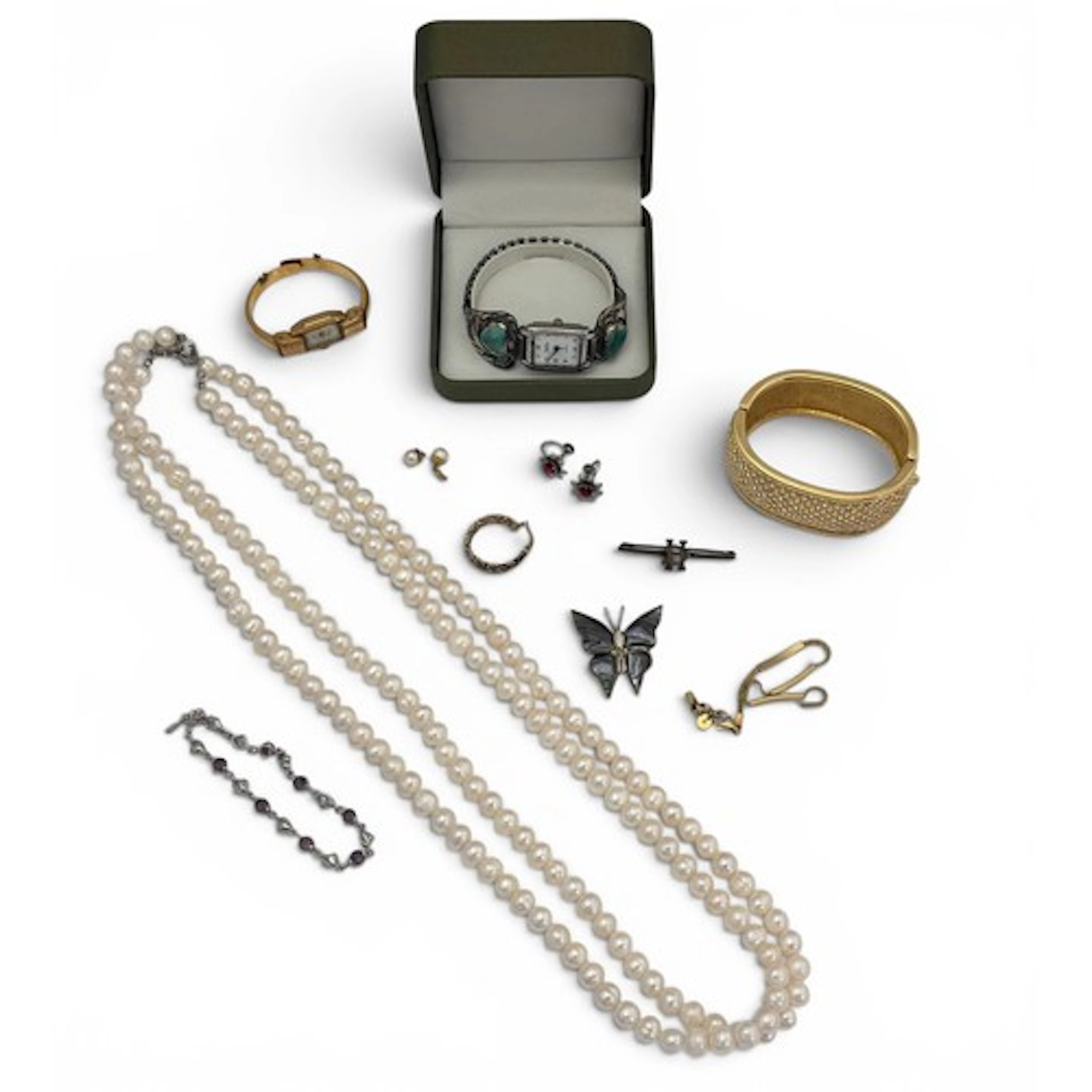 A freshwater pearl necklace with white metal clasp, a white ...