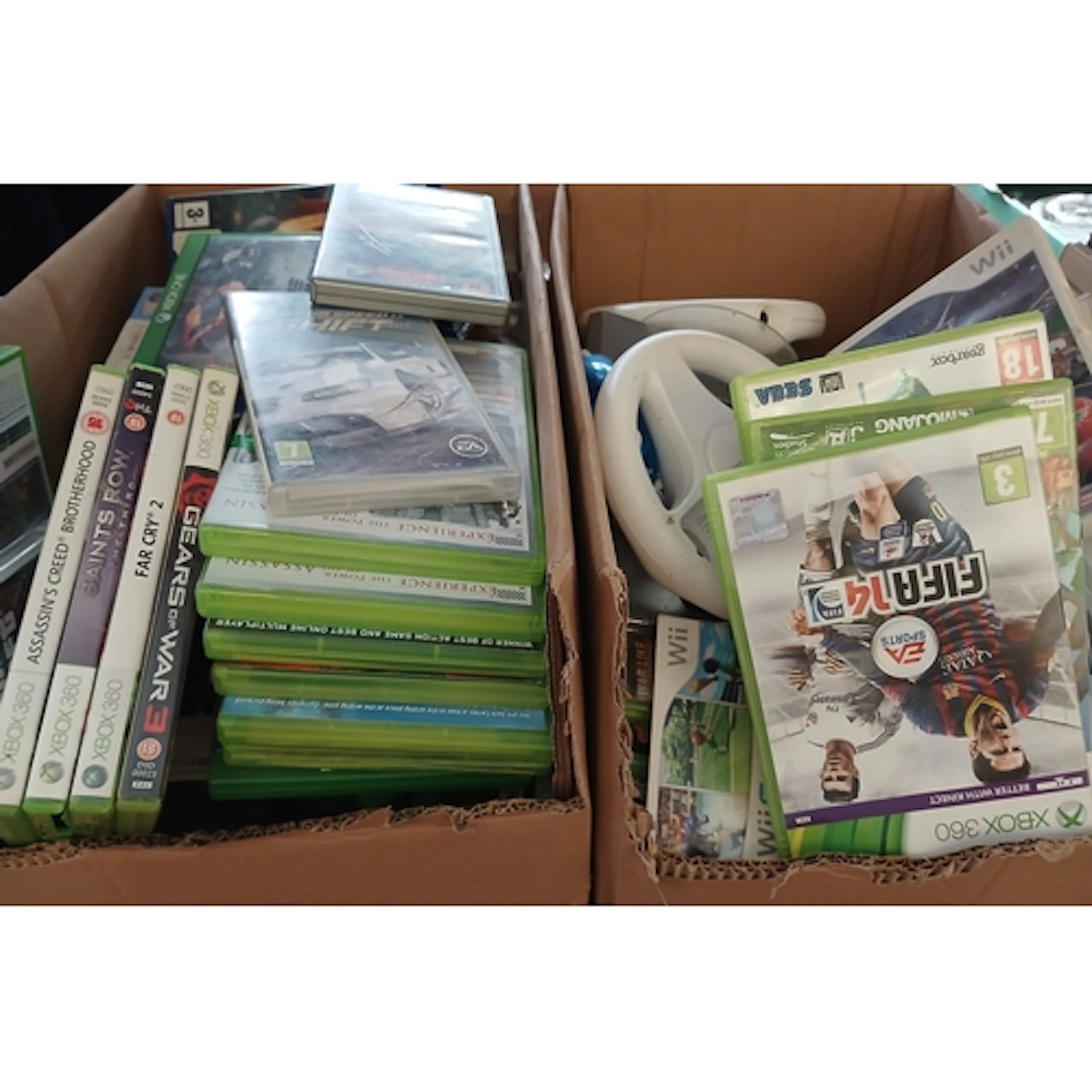 Two boxes to include 2 Wii consoles and accessories plus a l...
