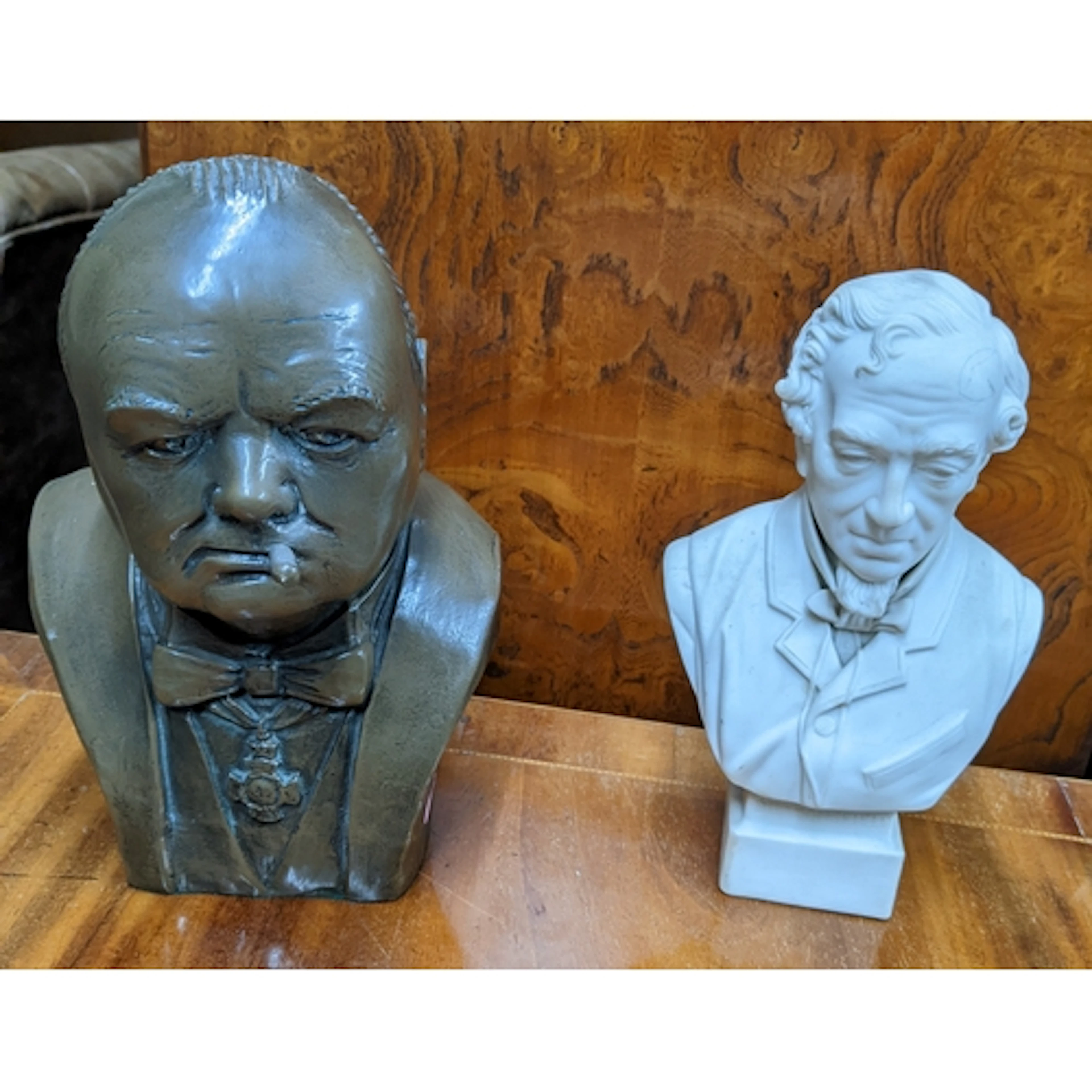 A bronzed composition bust of Churchill smoking a cigar, and...
