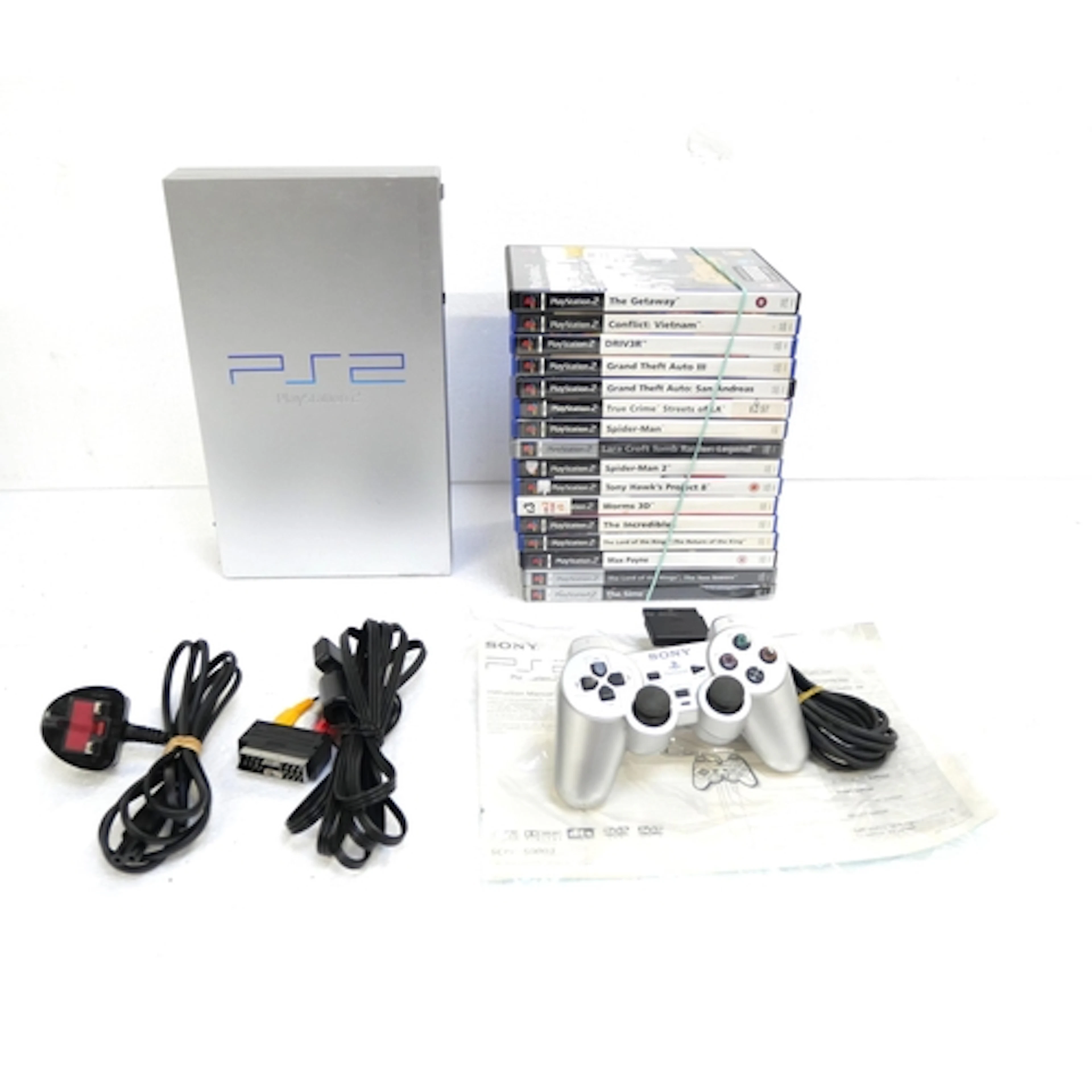 A boxed satin silver edition PlayStation 2 games console wit...