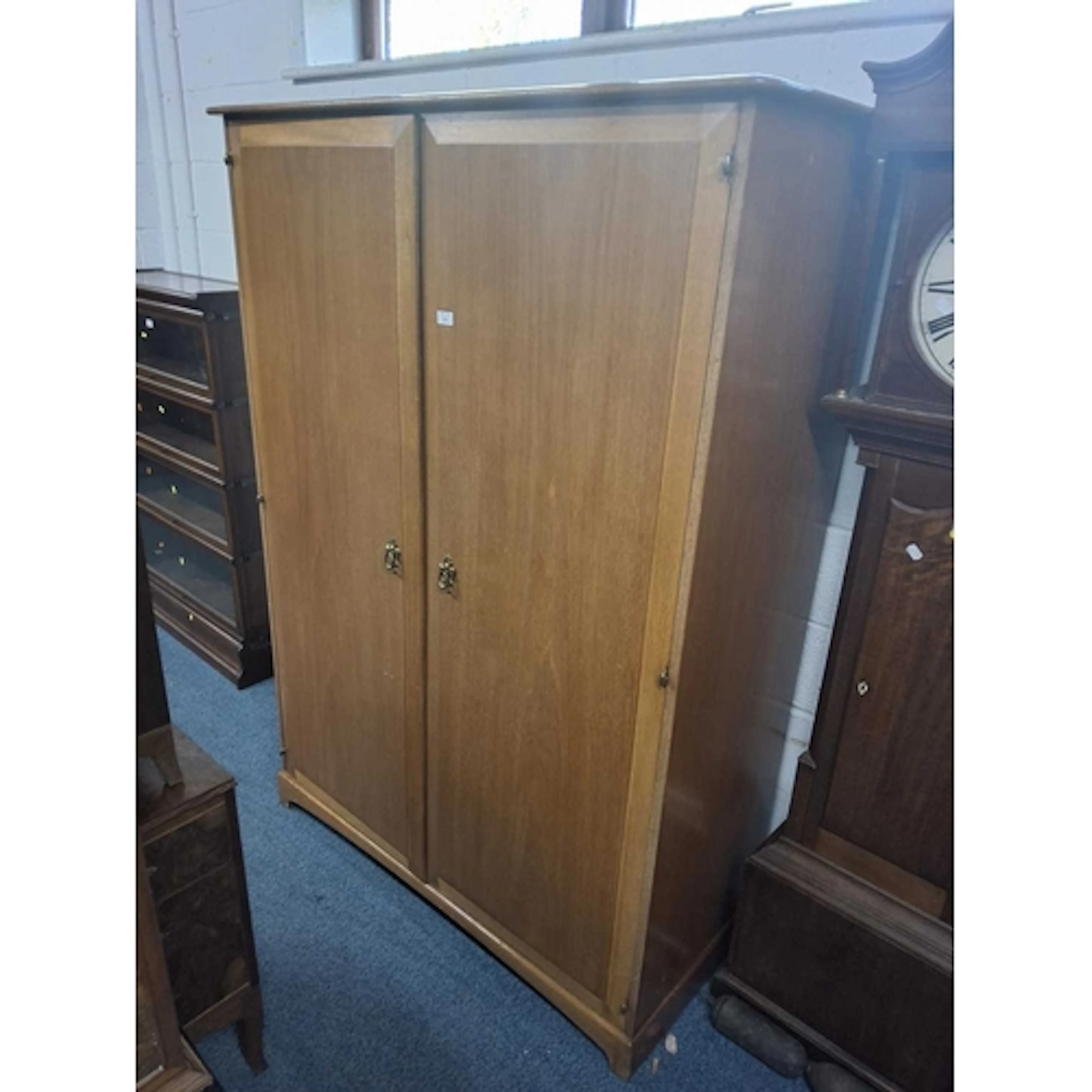 A LIGHT STAG MINSTREL TWO DOOR WARDROBE, width 129cm x depth...
