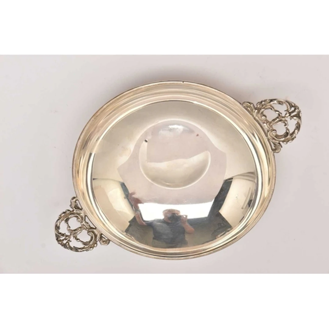 AN ELIZABETH II SILVER PORRINGER, fitted with double open wo...