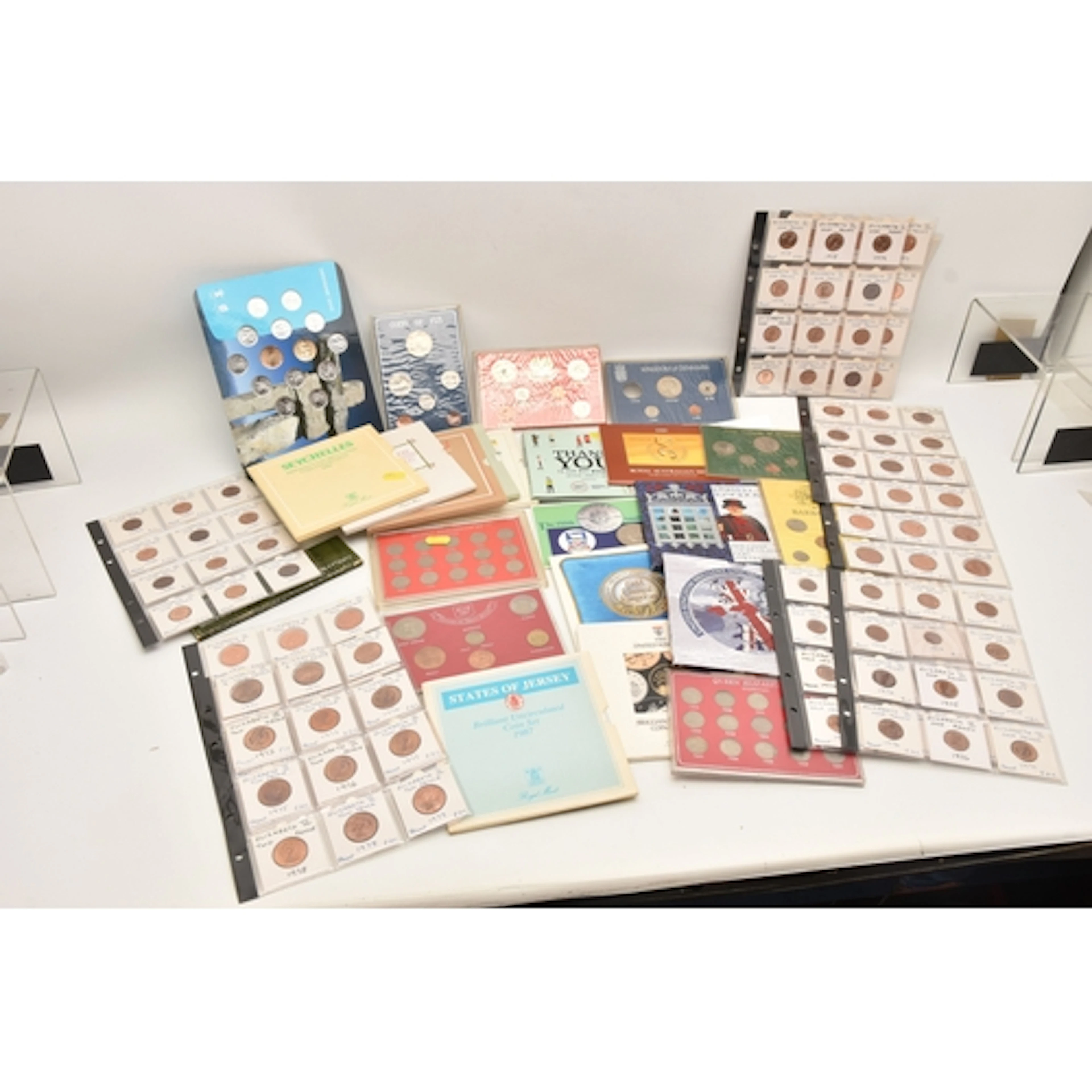 A BOX CONTAINING UK BRILLIANT UNCIRCULATED YEAR SETS, for 19...