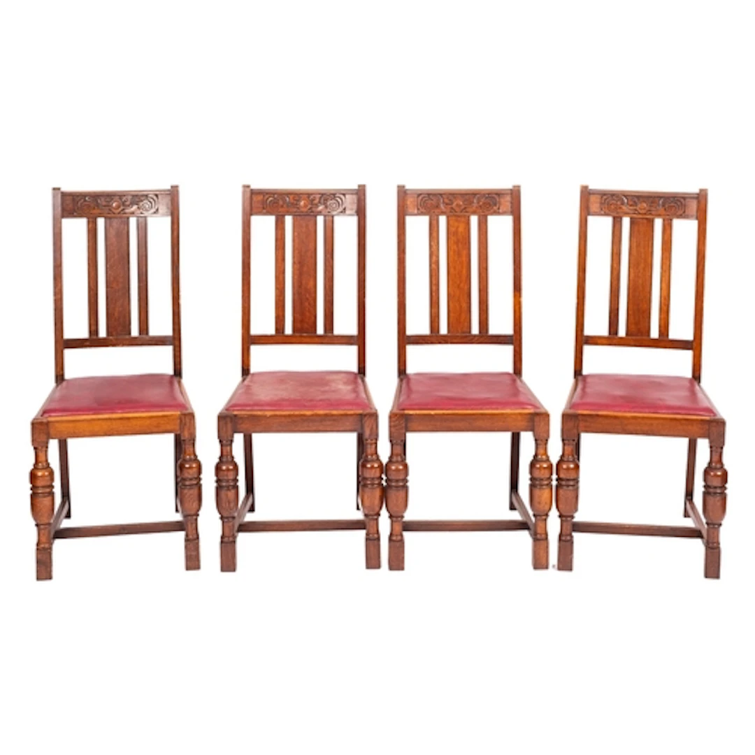 A set of four oak chairs in late 17th century taste, early 2...