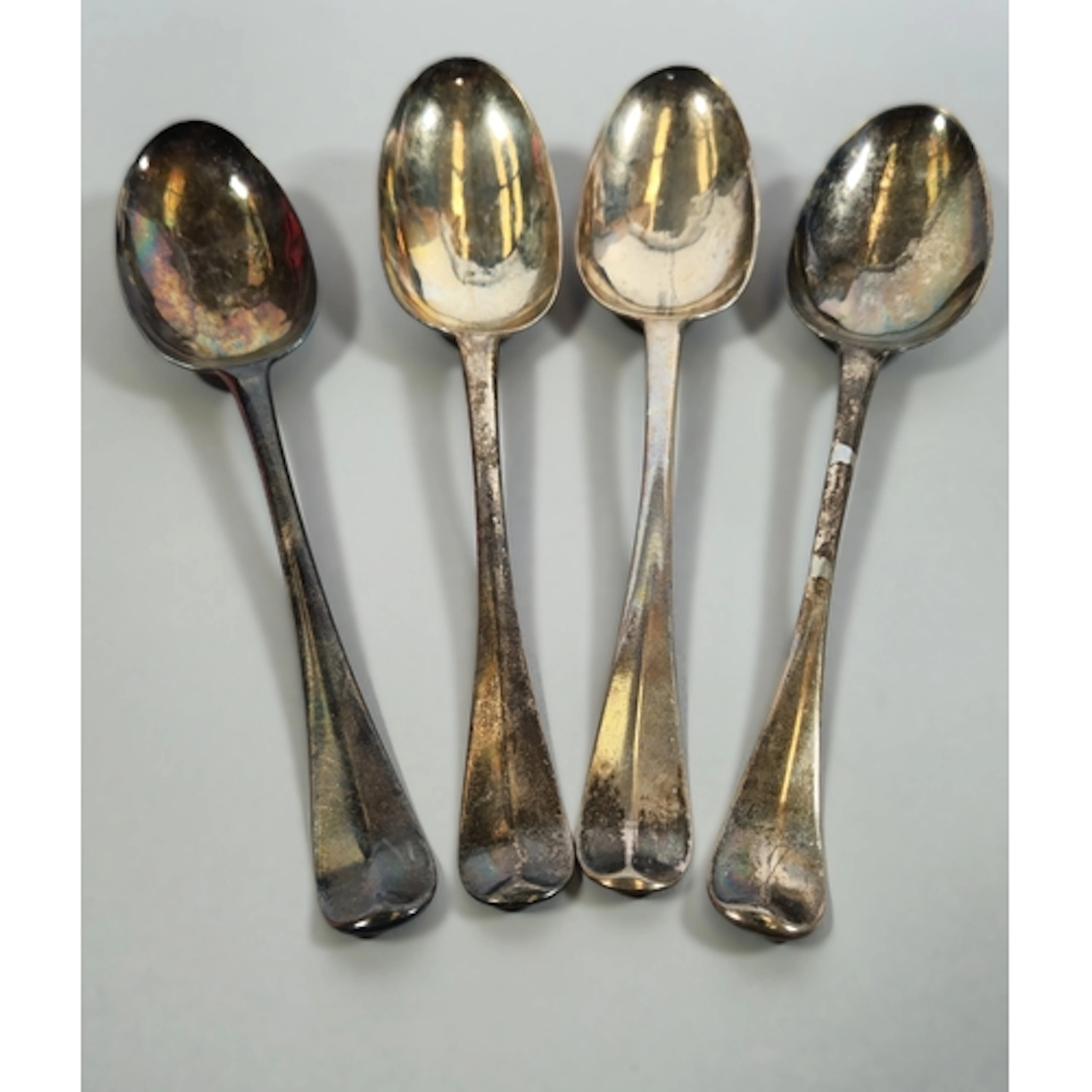 Four assorted Regency silver Old English pattern spoons, Lon...