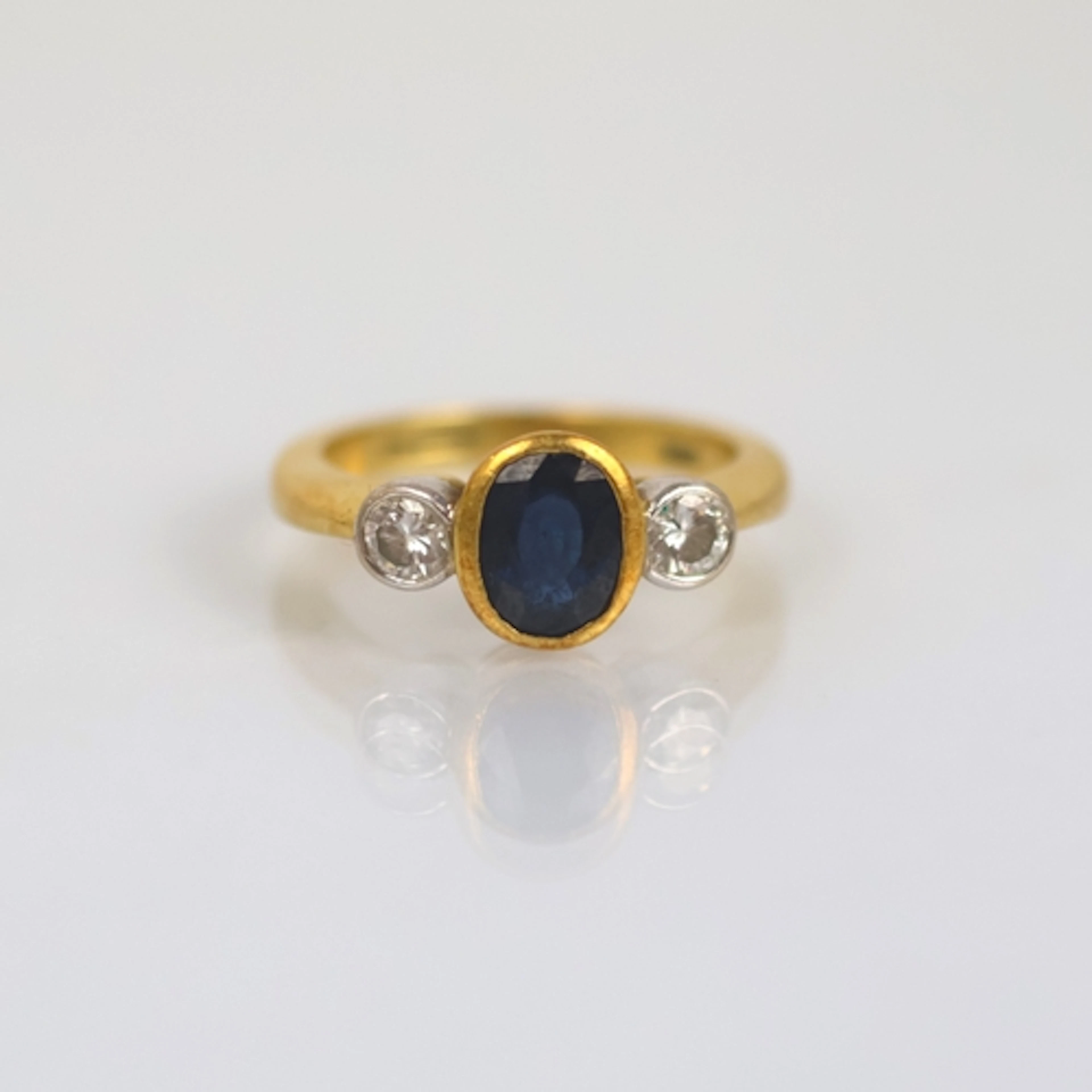A late 20th century 18ct yellow gold sapphire and diamond th...