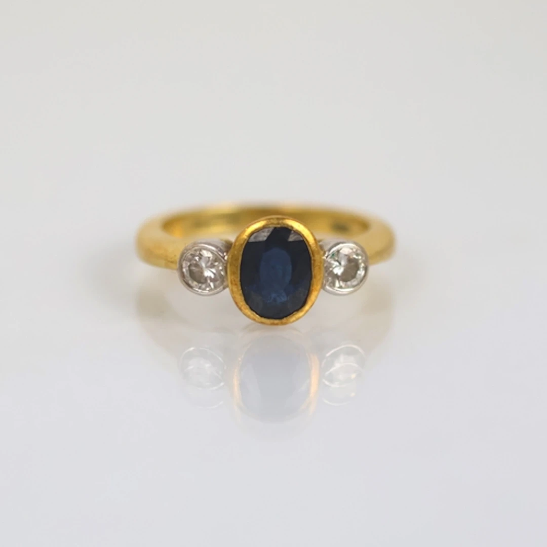 A late 20th century 18ct yellow gold sapphire and diamond th...