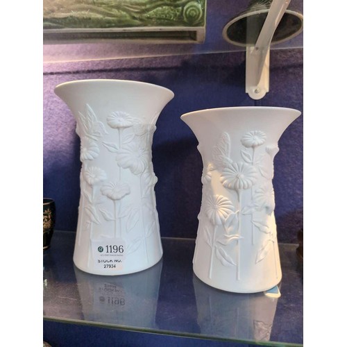 Two Kaiser porcelain matt white vases, decorated with daisie...