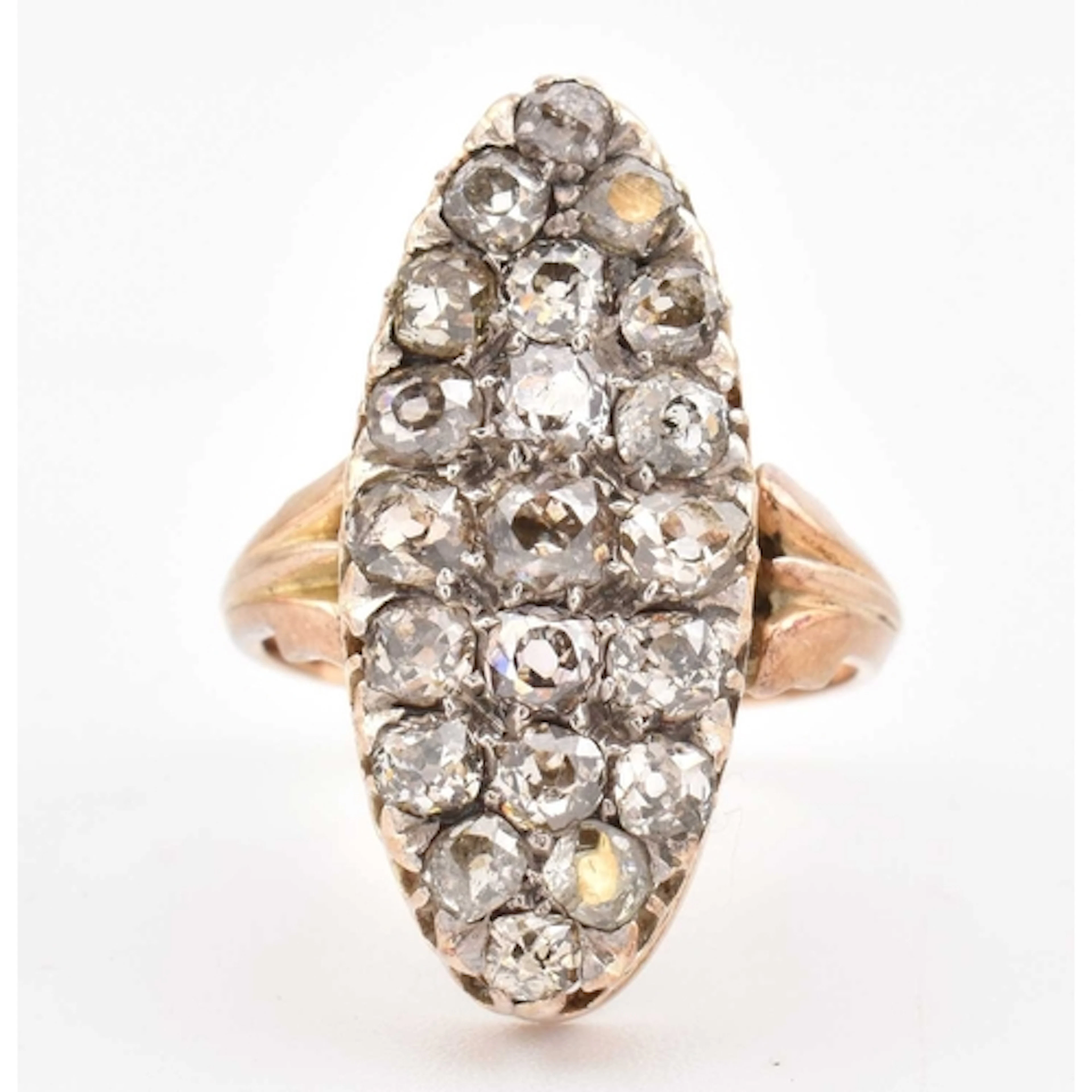 An early 20th century gold and diamond navette ring. The rin...