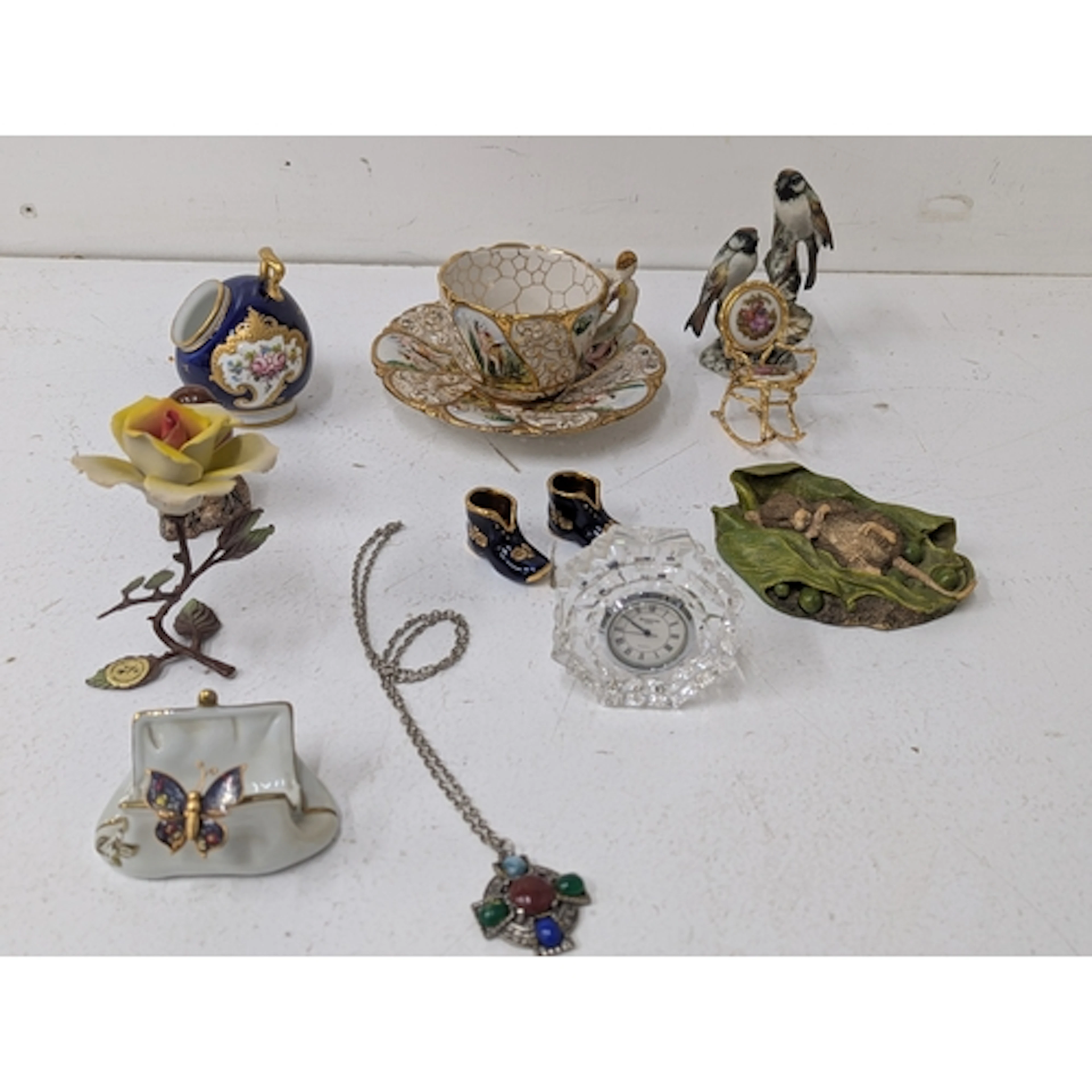 A mixed group of collectables to include a Capodimonte cup a...