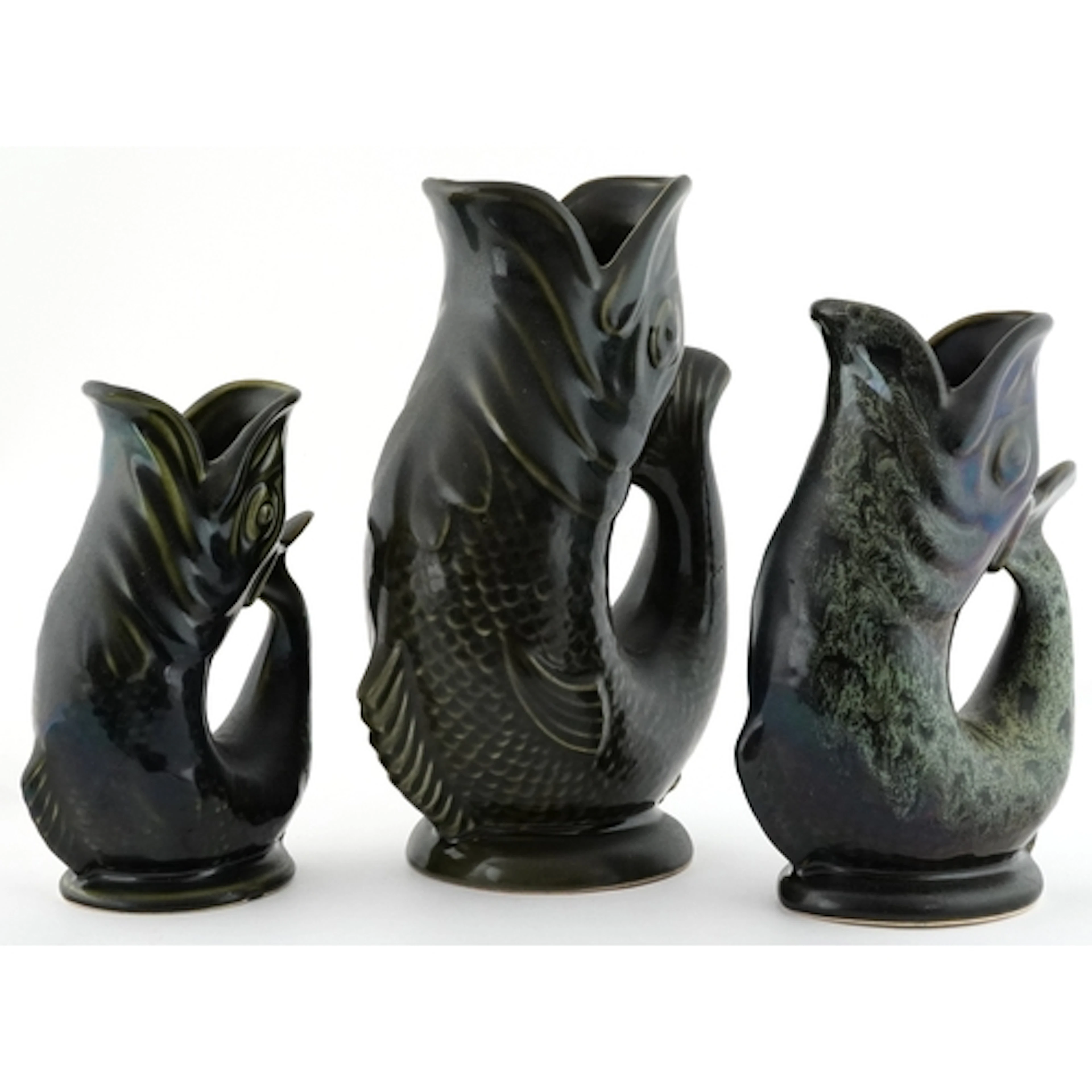 Four ceramic gluggle fish jugs including Dartmouth Devon, Fo...