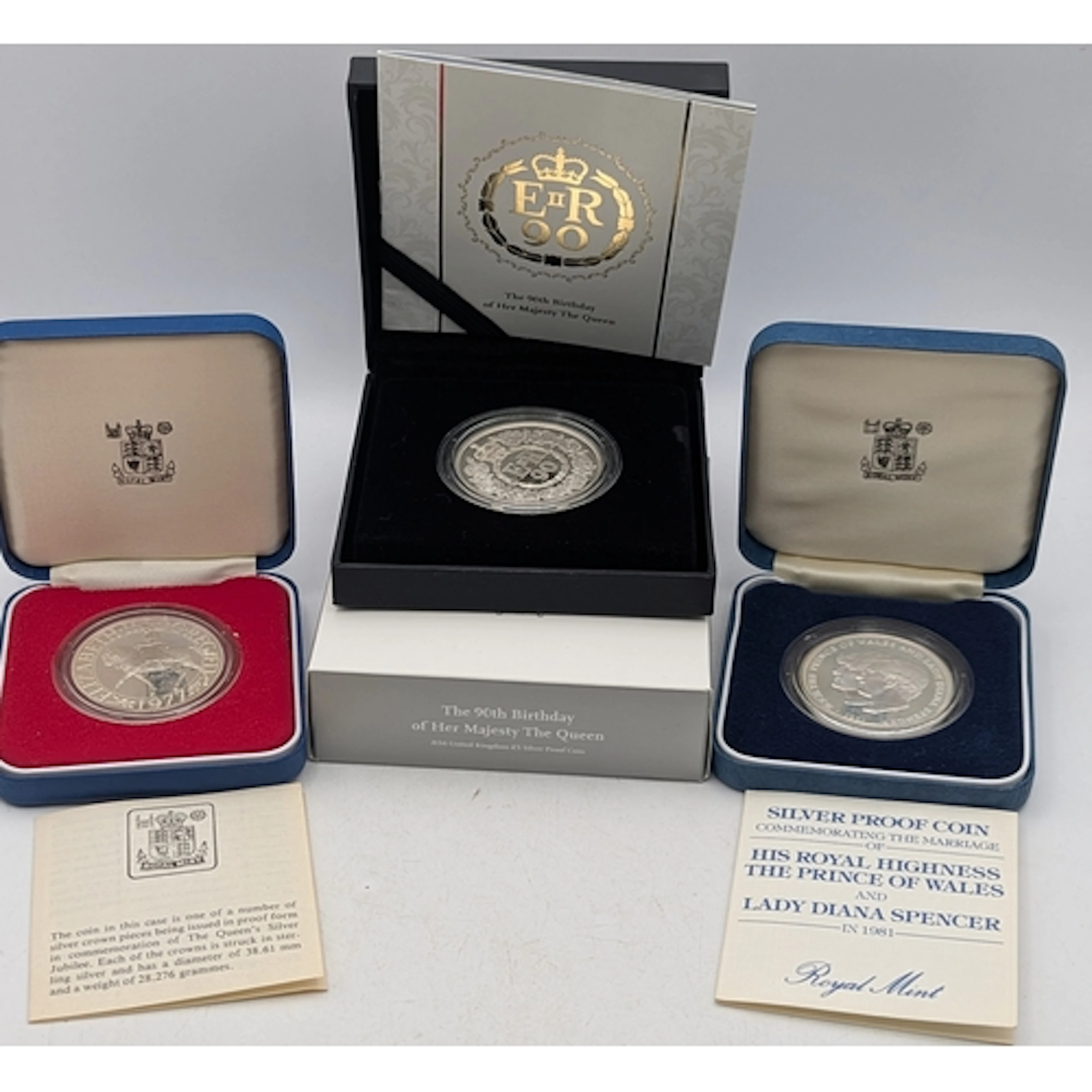 Three silver proof British commemorative coins to include a ...