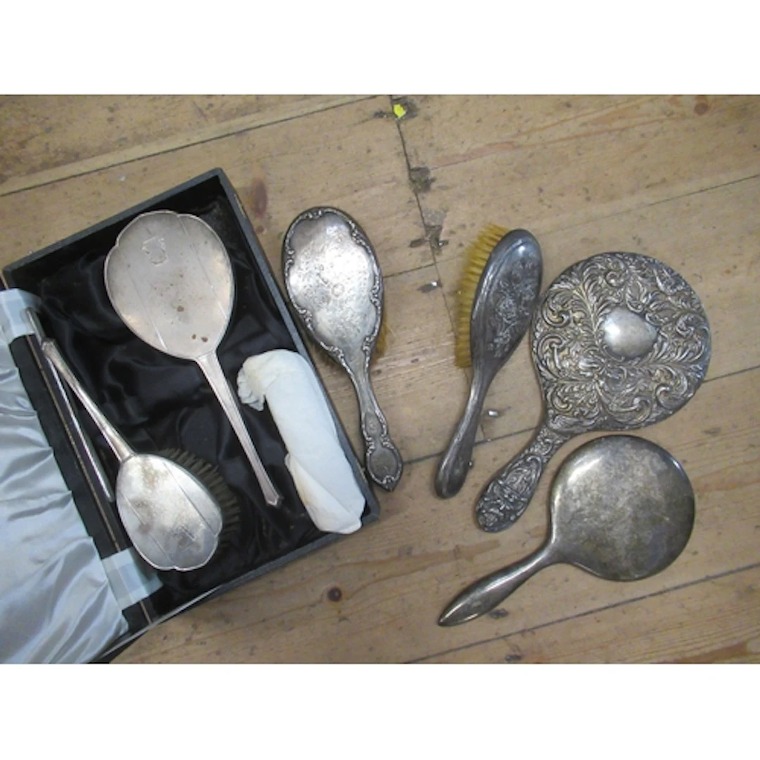 A collection of silver backed dressing table items