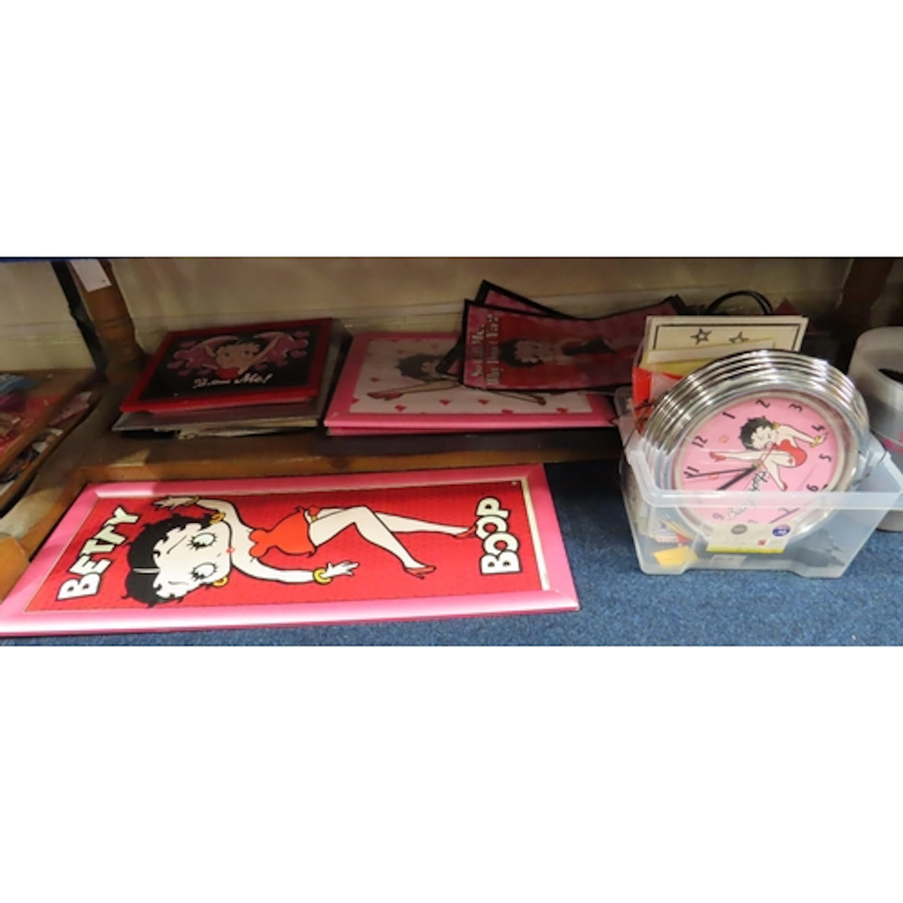 A collection of Betty Boop collectables including framed pos...