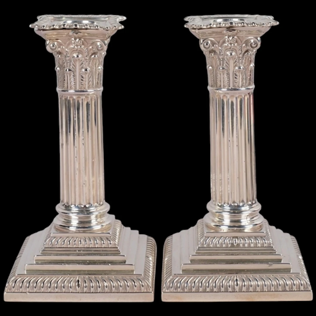 A pair of Victorian silver Corinthian column table candlesti...