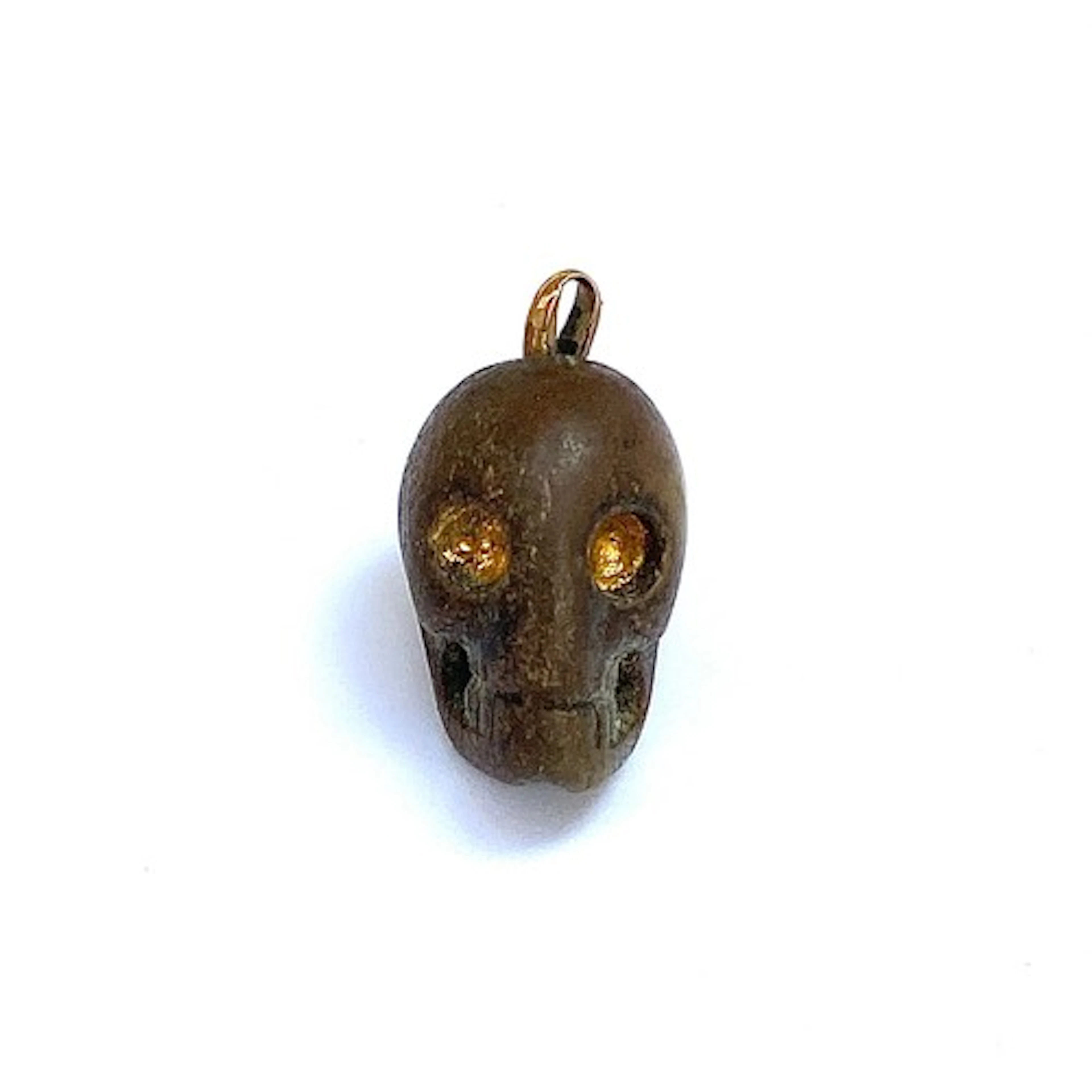 A 19th century or earlier carved stone memento mori skull pe...