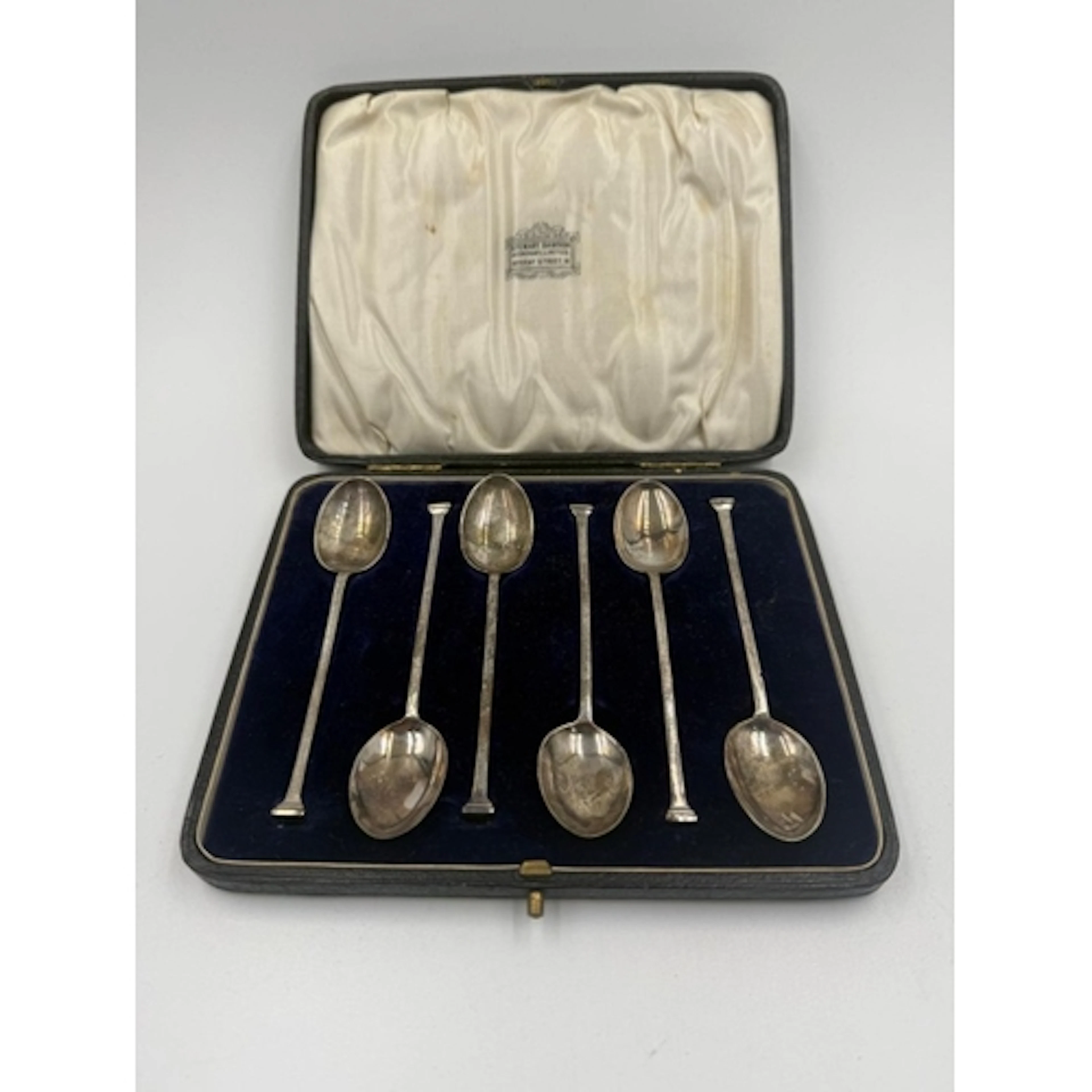 A cased set of six silver coffee spoons hallmarked for Sheff...