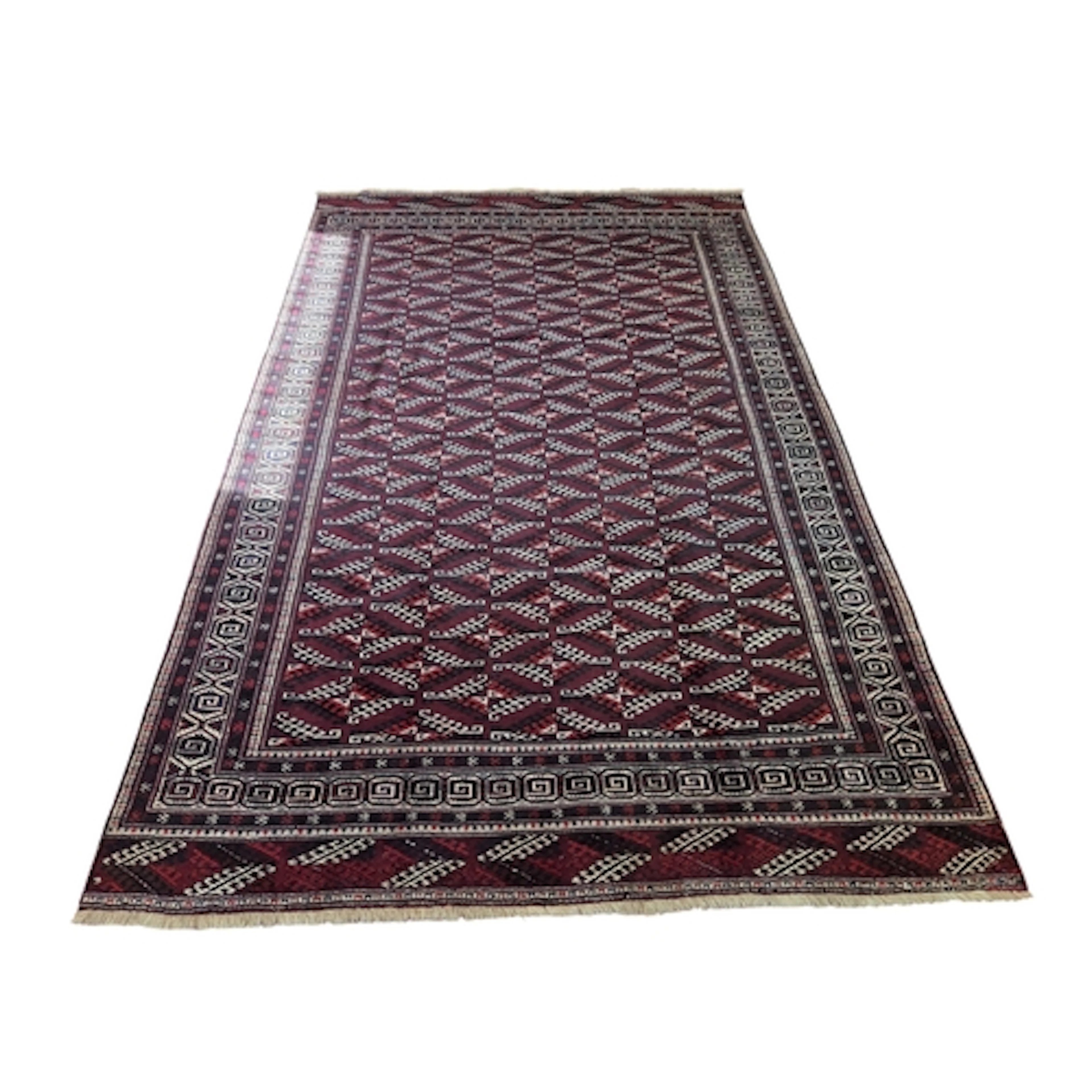 A deep Red ground full pile wool hand woven Turkman Carpet w...