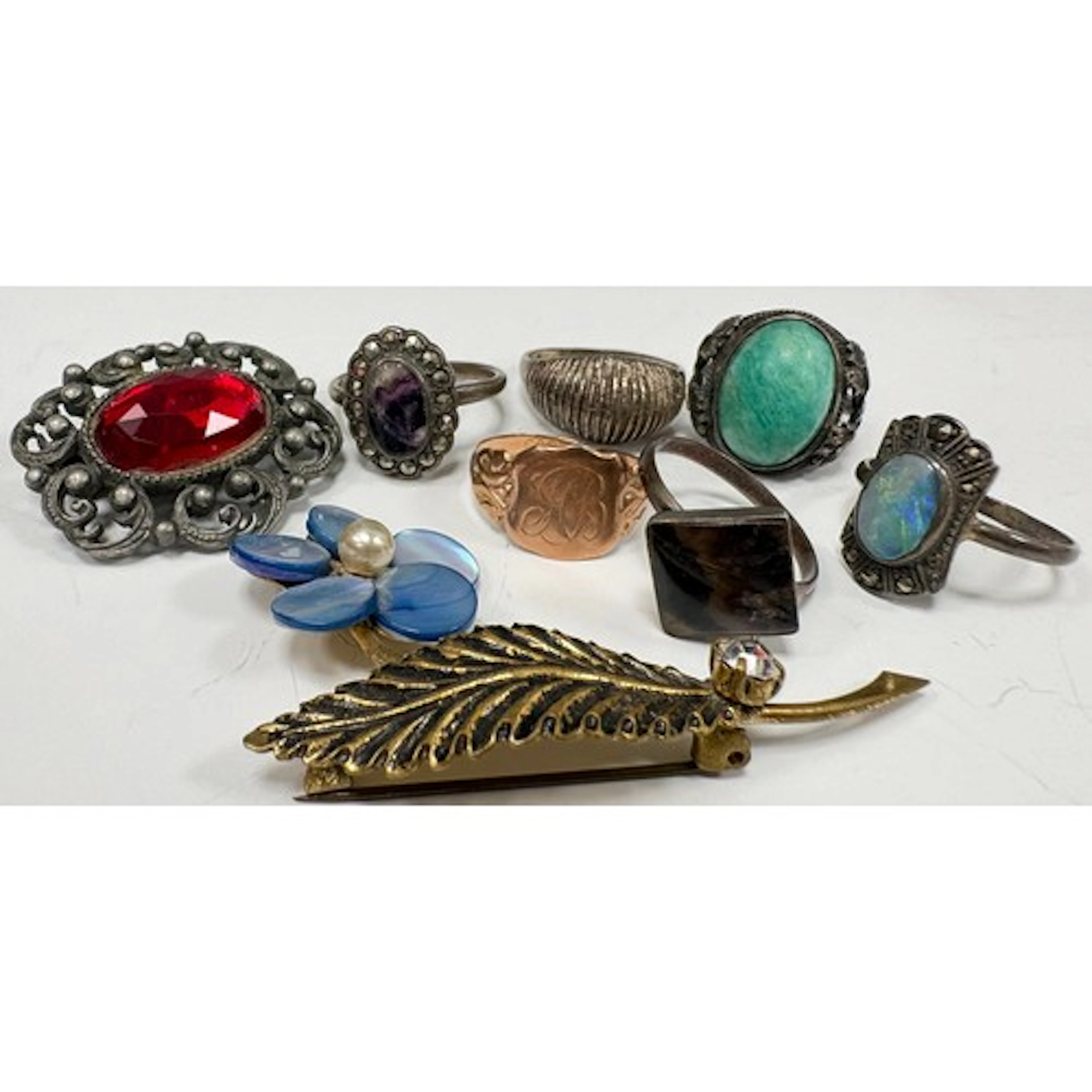 A selection of 9ct gold, silver and costume jewellery; the 9...