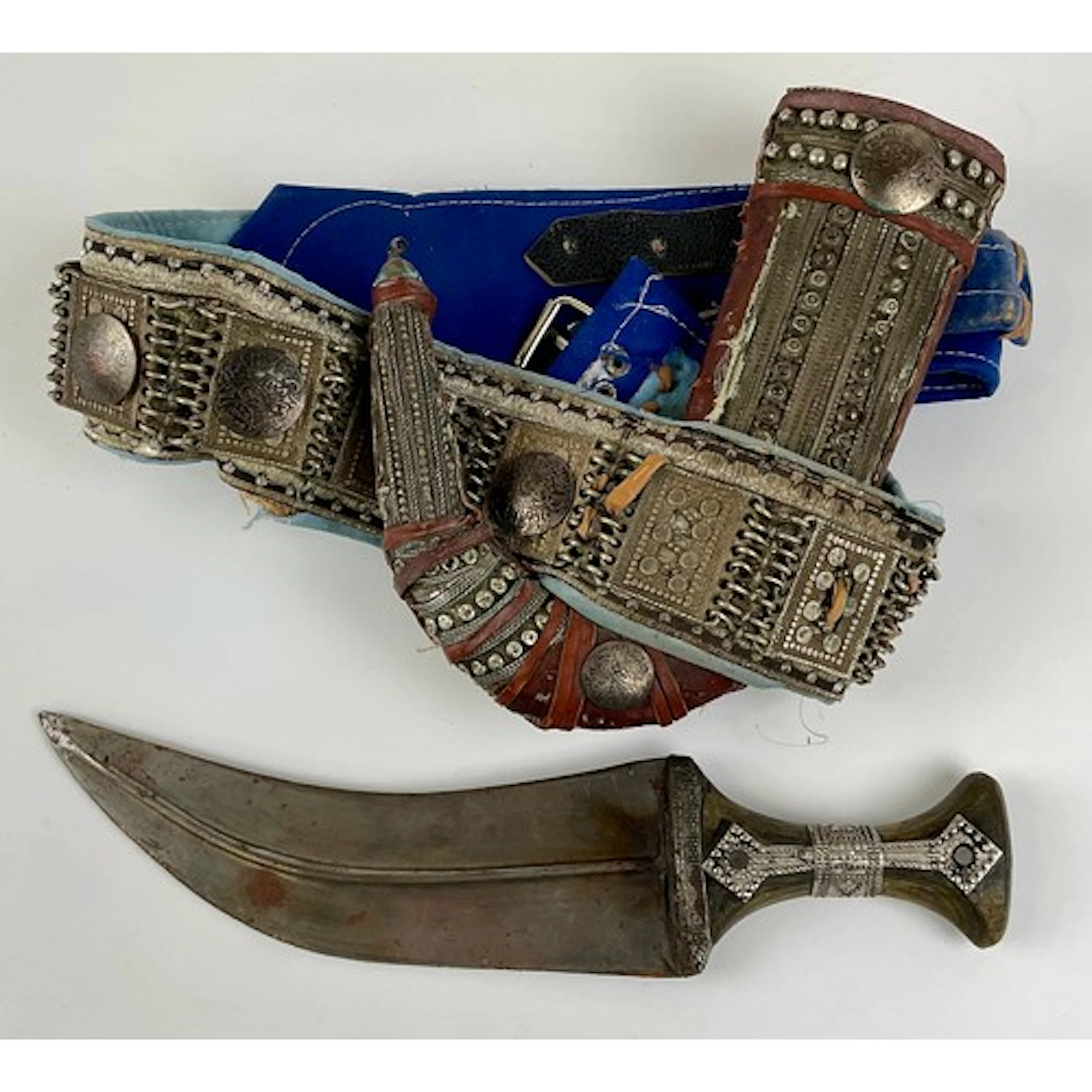 A Middle Eastern silver coloured metal mounted jambiya dagge...