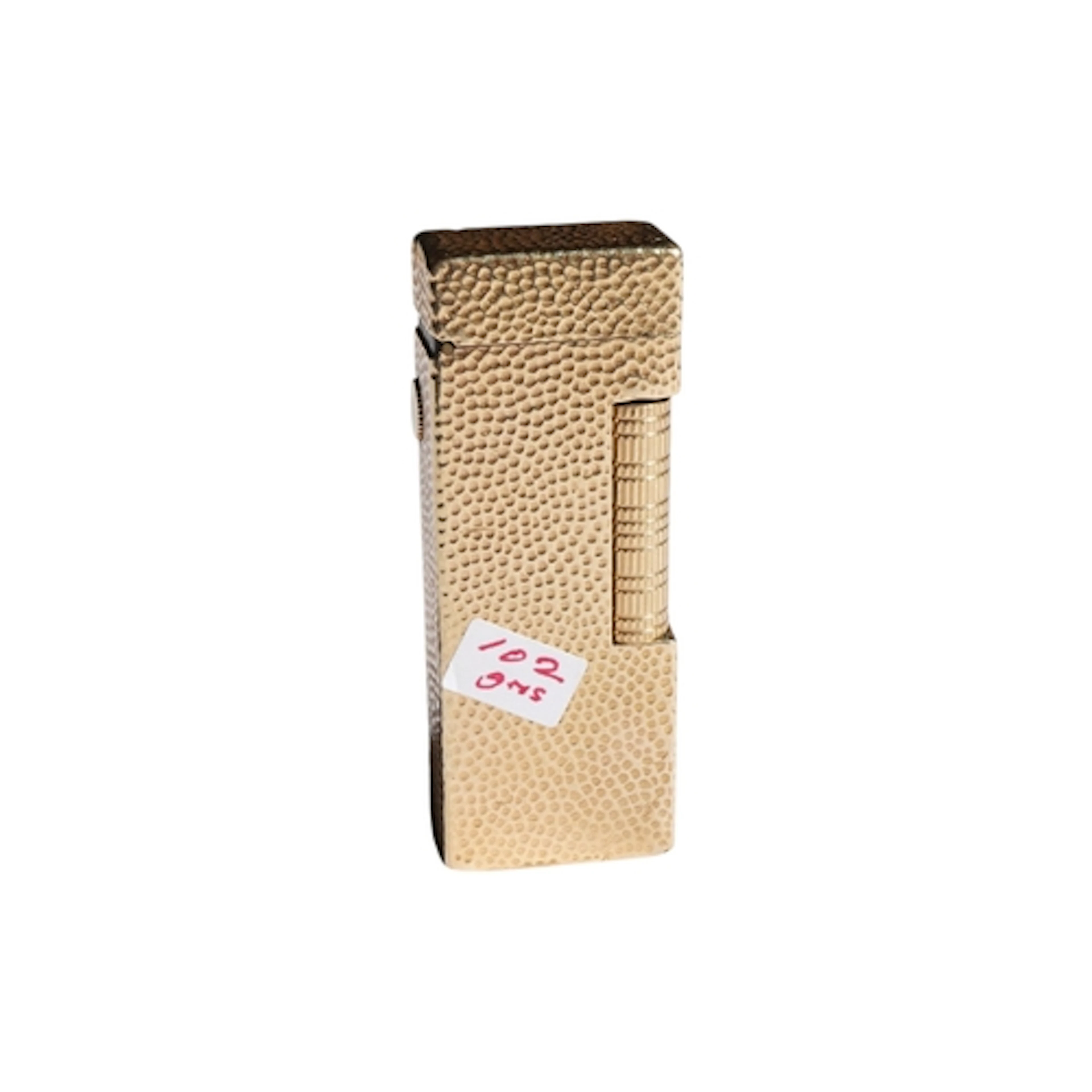 A Dunhill vintage hammered effect 14kt. gold lighter (approx...