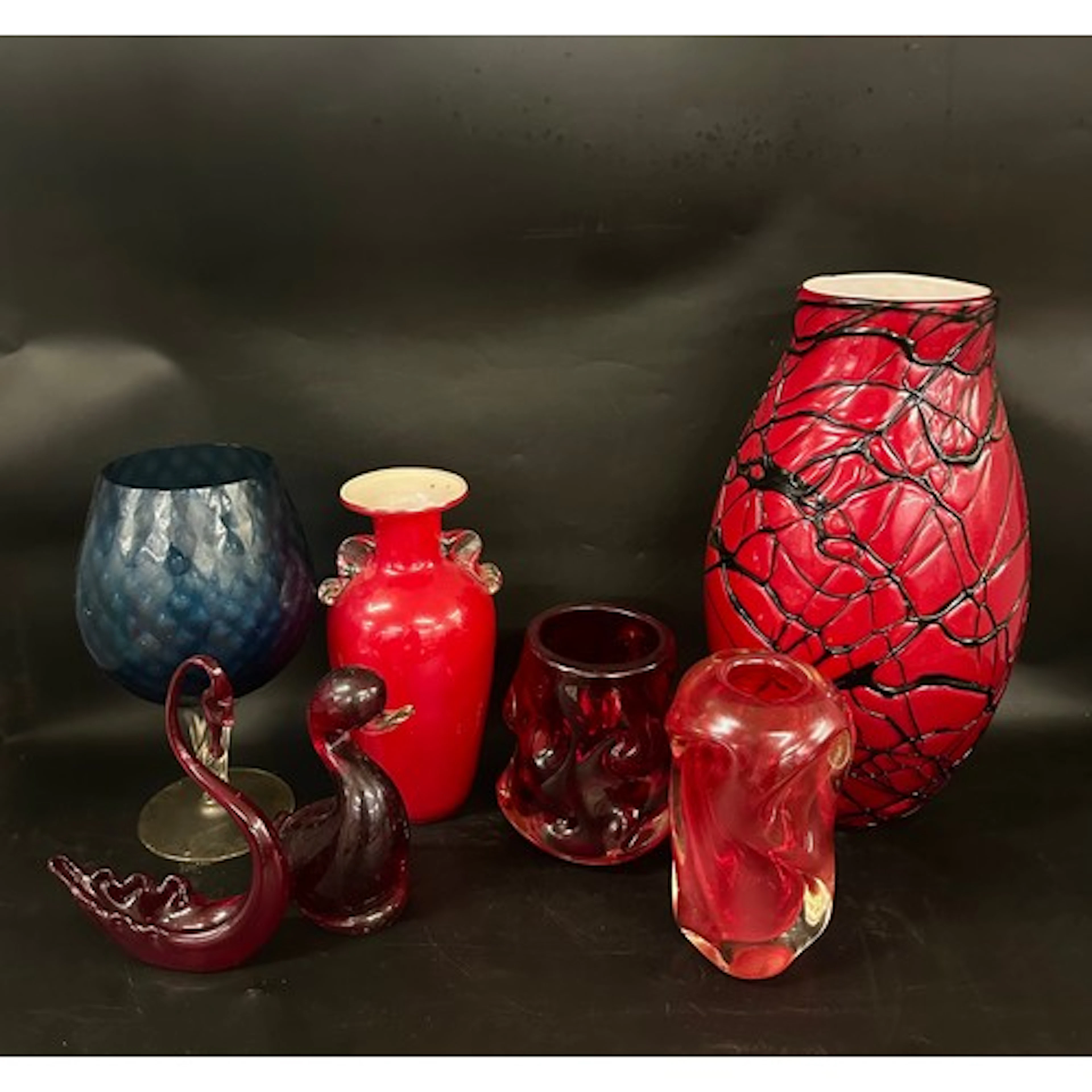 A collection of studio art glass, tallest 32cm