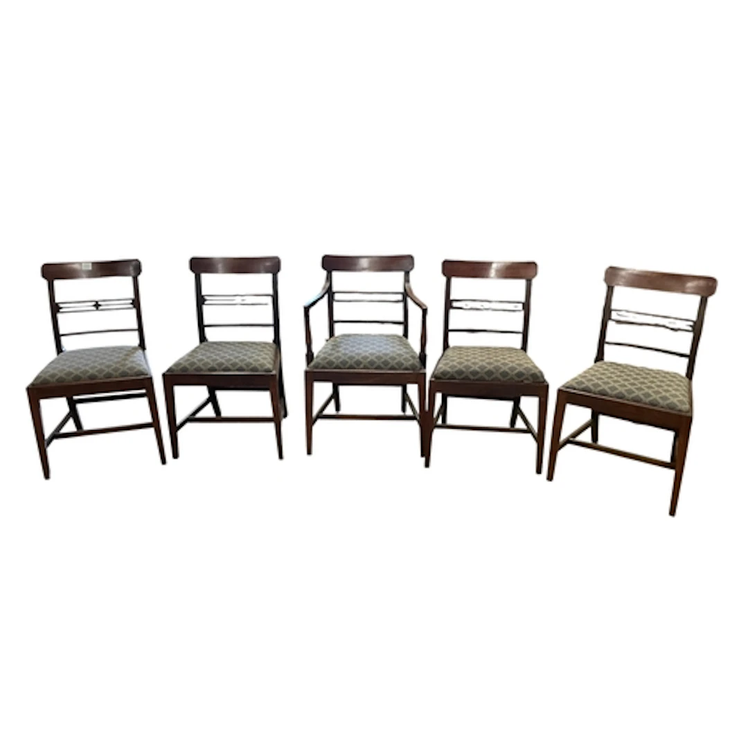 A set of six Regency mahogany dining chairs including an elb...