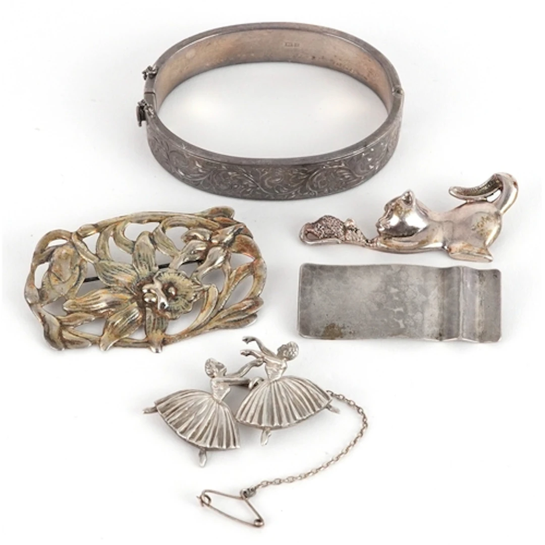 Antique and later silver jewellery comprising hinged bangle,...