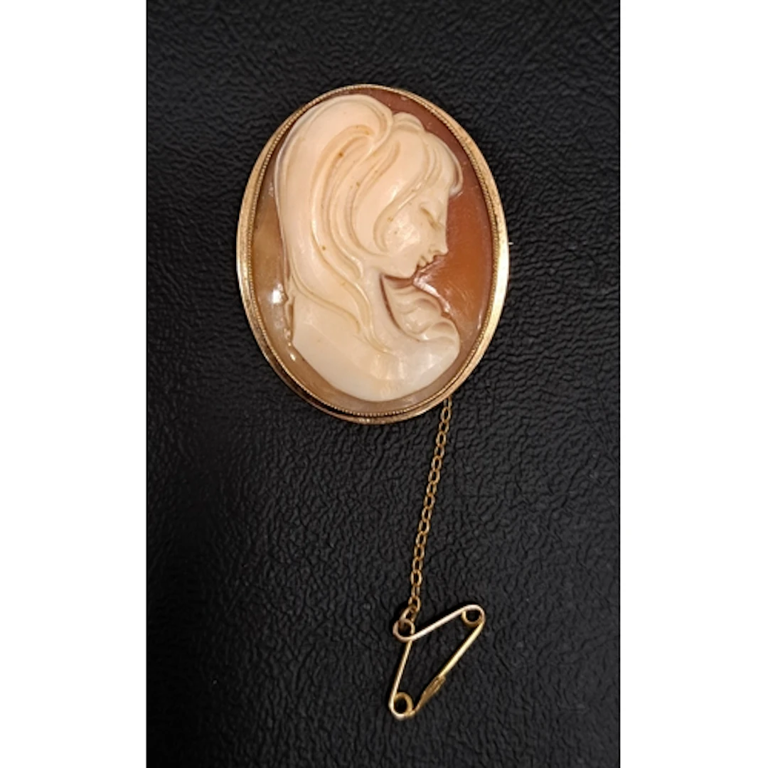 SHELL CAMEO BROOCH featuring a demure female bust, in nine c...