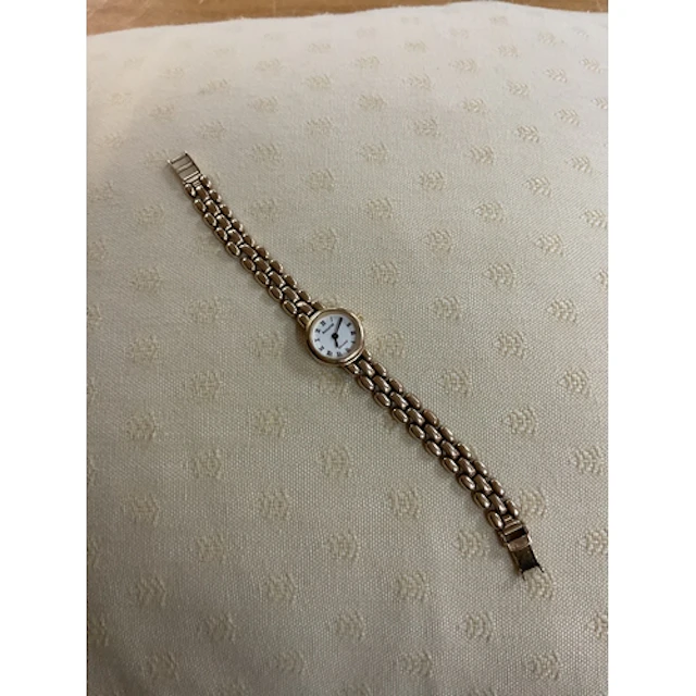 Ladies gold accuracy watch on gold strap.total weight with m...