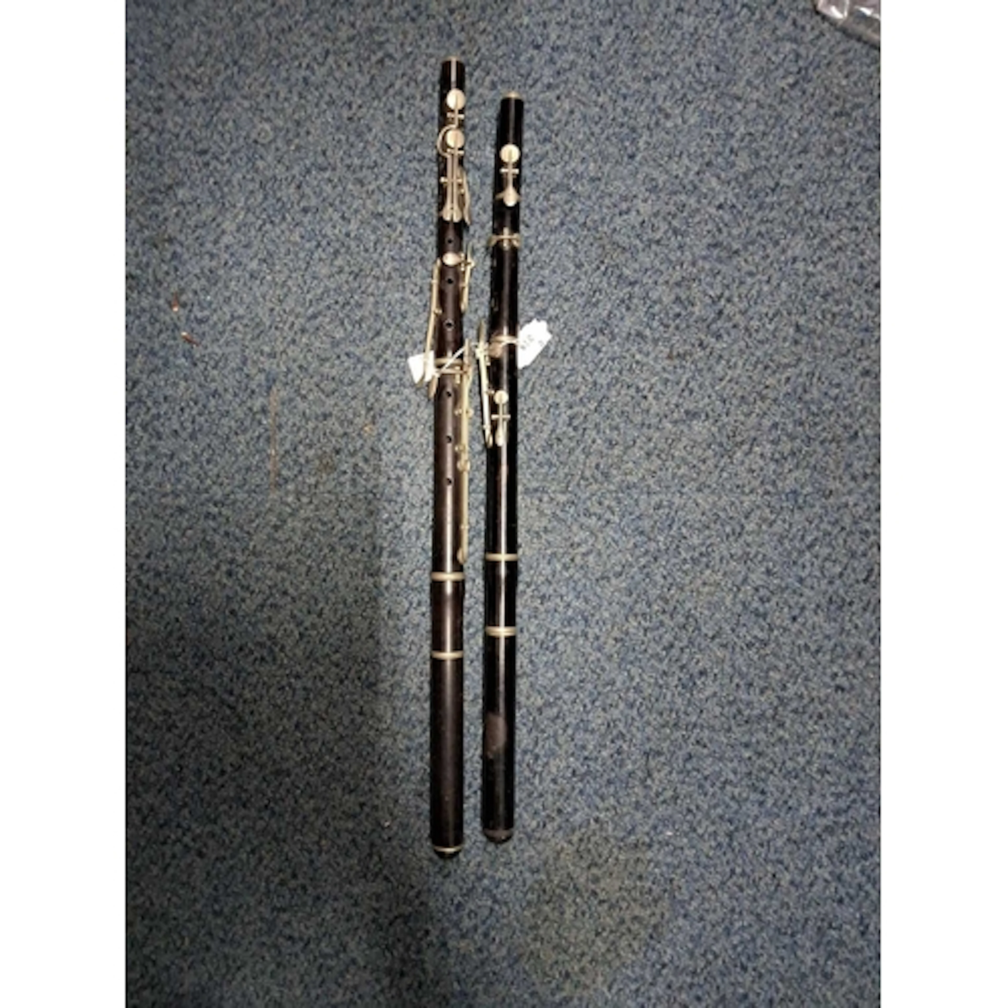 TWO EARLY 20th CENTURY WOODEN FLUTES, the first being of tur...