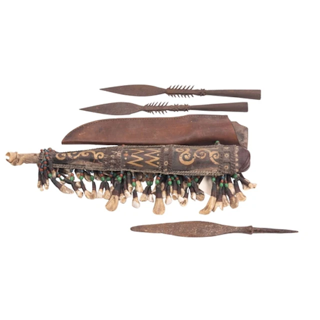 A South African iron spear head in painted wooden sheath, de...