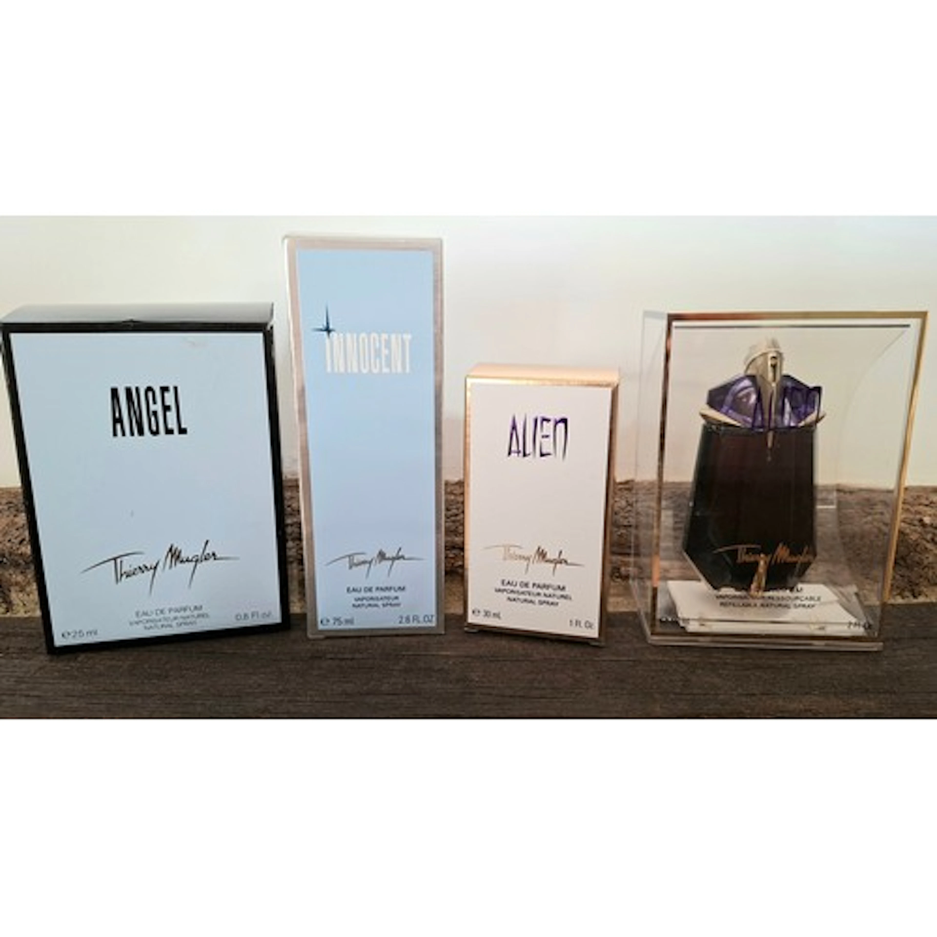 Thierry Mugler- Three fragrances and an empty bottle compris...