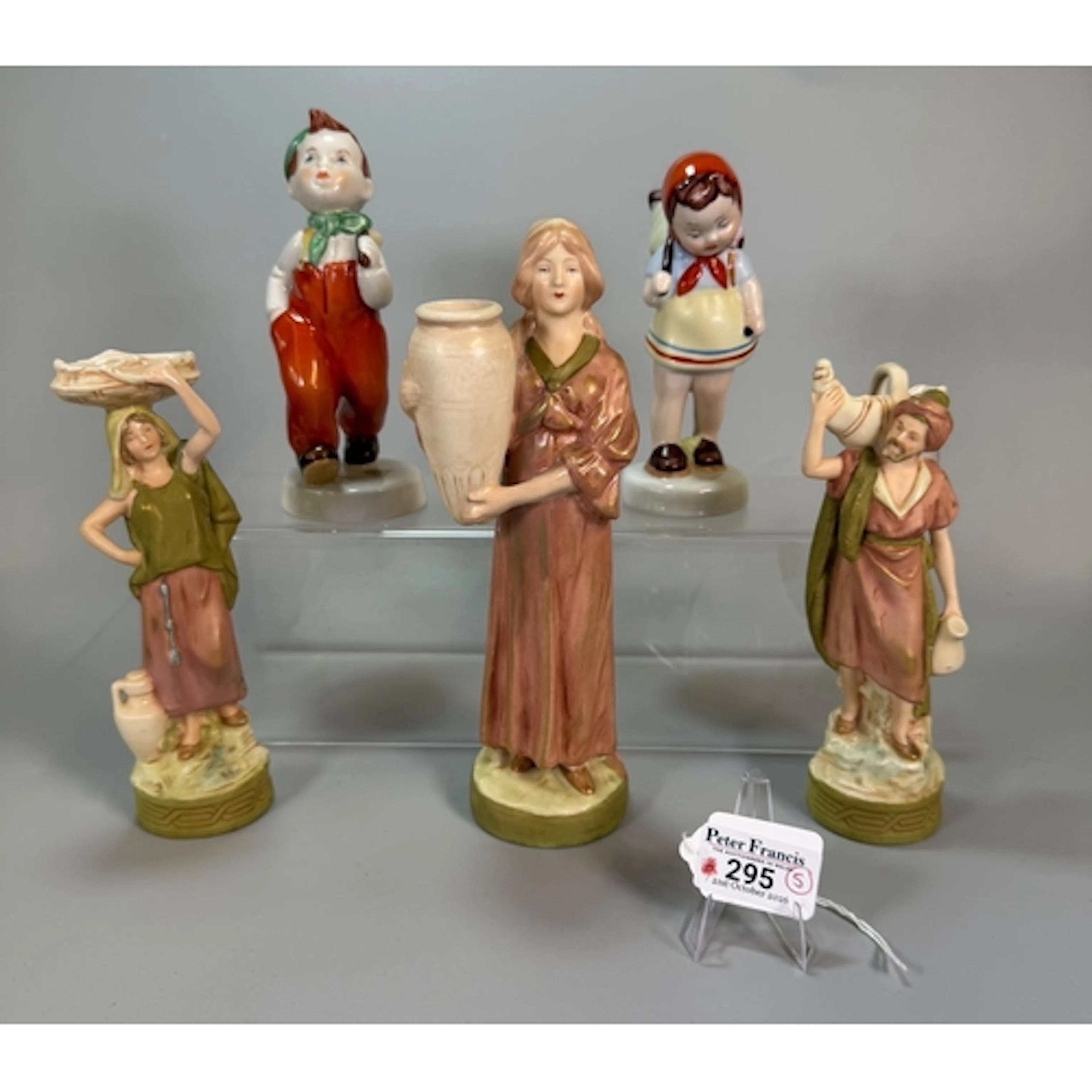 Collection of Royal Dux porcelain figurines of water carrier...