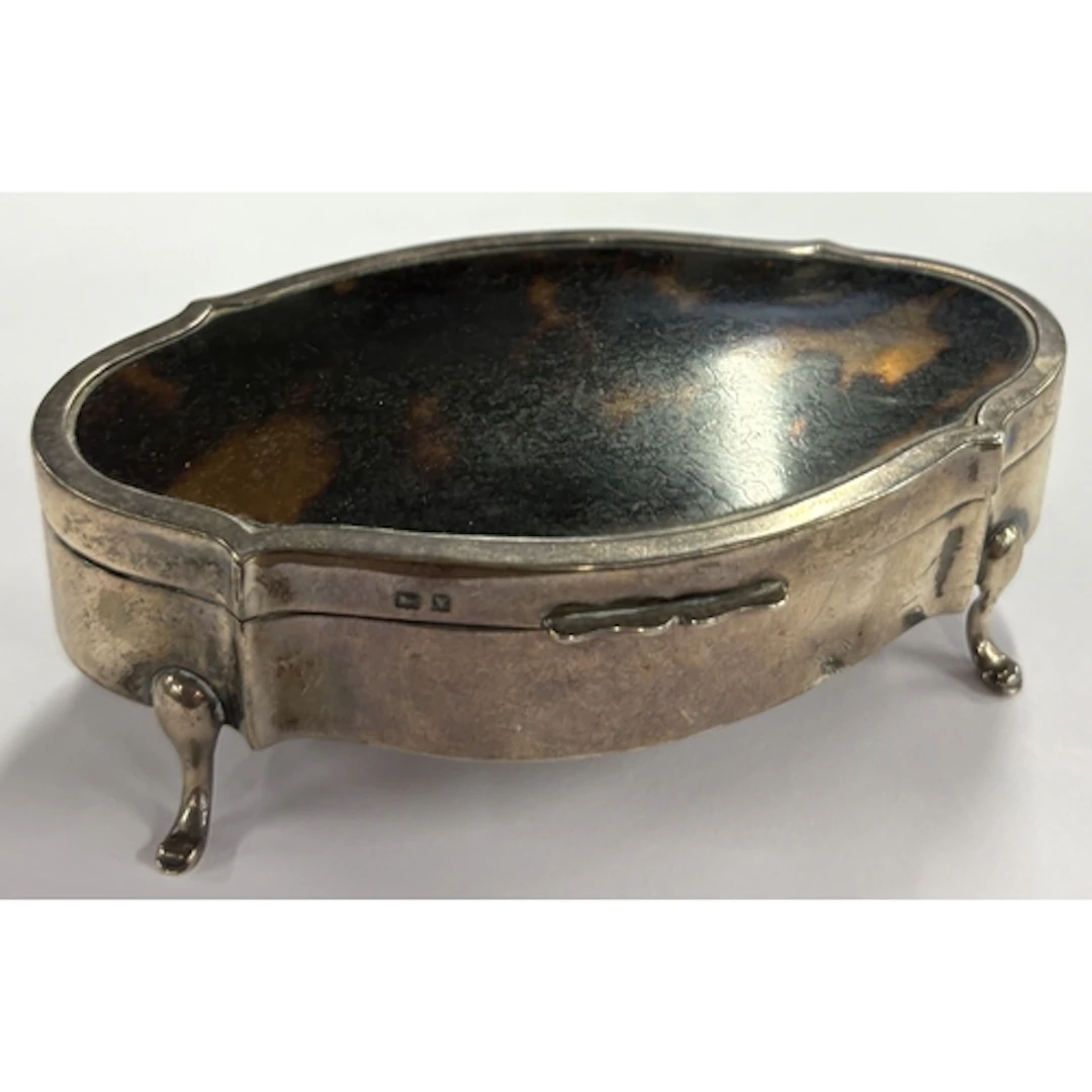 A silver and faux tortoiseshell box. Birmingham 1920. Approx...
